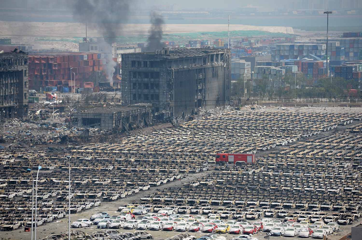 TIANJIN, CHINA - AUGUST 13:  (CHINA OUT) Thousands of burnt and destroyed vehicles are seen in Tianjin's warehouse explosion on August 13, 2015 in Tianjin, China. The death toll from Wednesday warehouse explosions in Tianjin rose to 50 Thursday evening, 17 of whom were firemen, local authorities said.  (Photo by ChinaFotoPress/ChinaFotoPress via Getty Images)