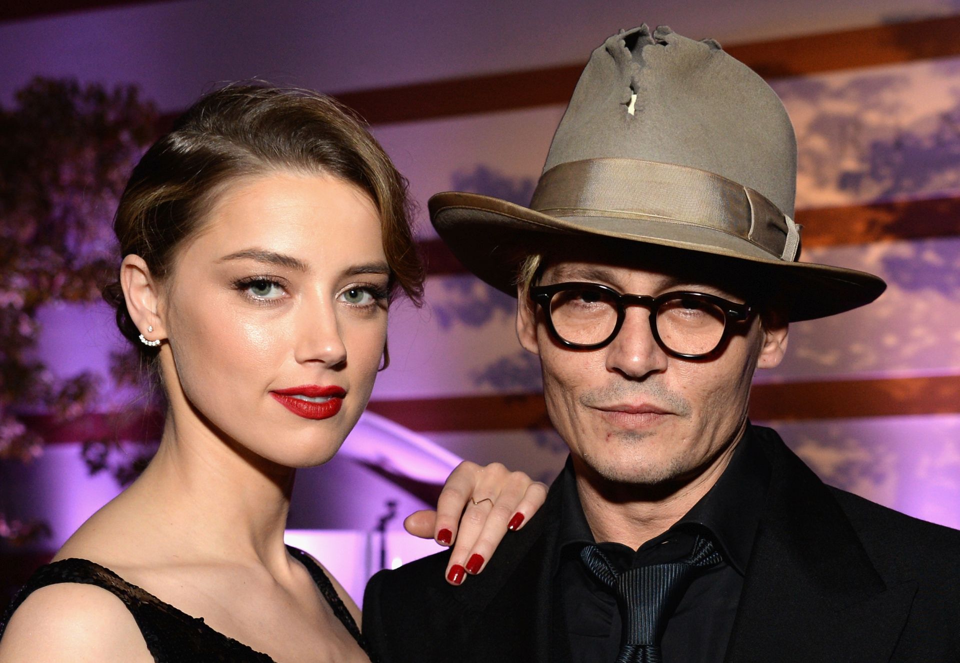 LOS ANGELES, CA - JANUARY 11:  Actors Amber Heard (L) and Johnny Depp attend The Art of Elysium's 7th Annual HEAVEN Gala presented by Mercedes-Benz at Skirball Cultural Center on January 11, 2014 in Los Angeles, California.  (Photo by Michael Kovac/Getty Images for Art of Elysium)