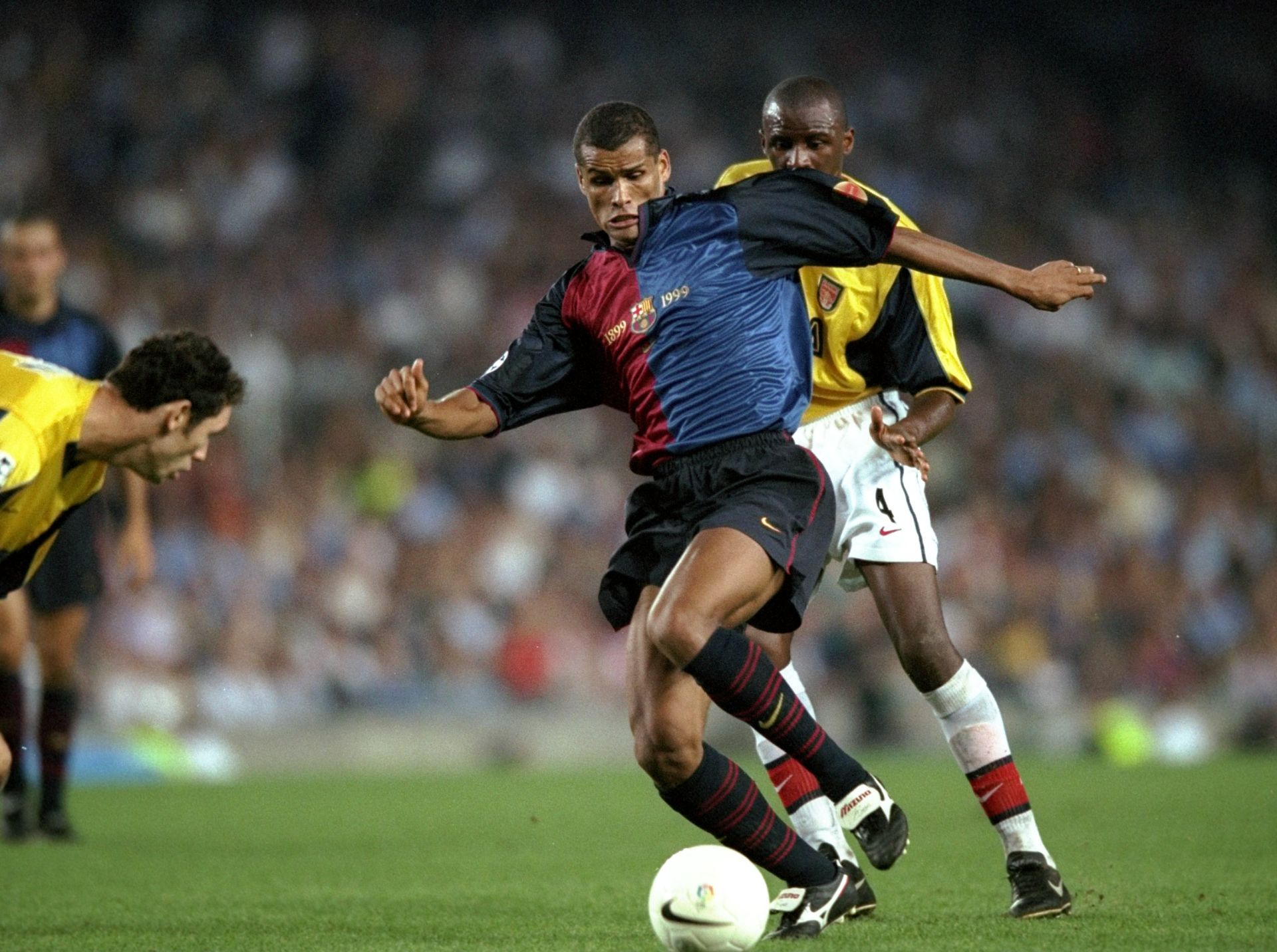 29 Sep 1999:  Rivaldo of Barcelona is challenged by Patrick Rieira and Martin Keown of Arsenal during the Champions League match played at  the Nou Camp Stadium in Barcelona, Spain. The game ended in a 1-1 draw.  Mandatory Credit: Shaun Botterill /Allsport