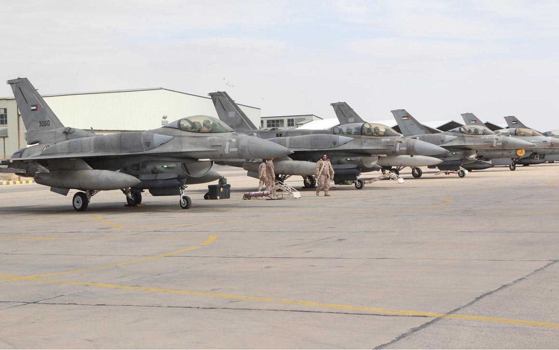 JORDAN:  This handout picture released by the official Jordanian news agency, PETRA on February 8, 2015, shows a squadron of United Arab Emirates (UAE) F-16 fighters stationed in one of Jordan's air bases to support it in strikes against the Islamic State group. The squadron of UAE F-16 fighter jets, which also includes C-17 troop and supply carriers and refuelling planes, which arrived to help the kingdom in its fight against the Islamic State which burned alive one of its pilots. UAE squadron chief Saeed Hassan told Petra the team "stands ready to carry out any mission in coordination with the Jordanian armed forces." (Photo by PETRA via Getty Images)