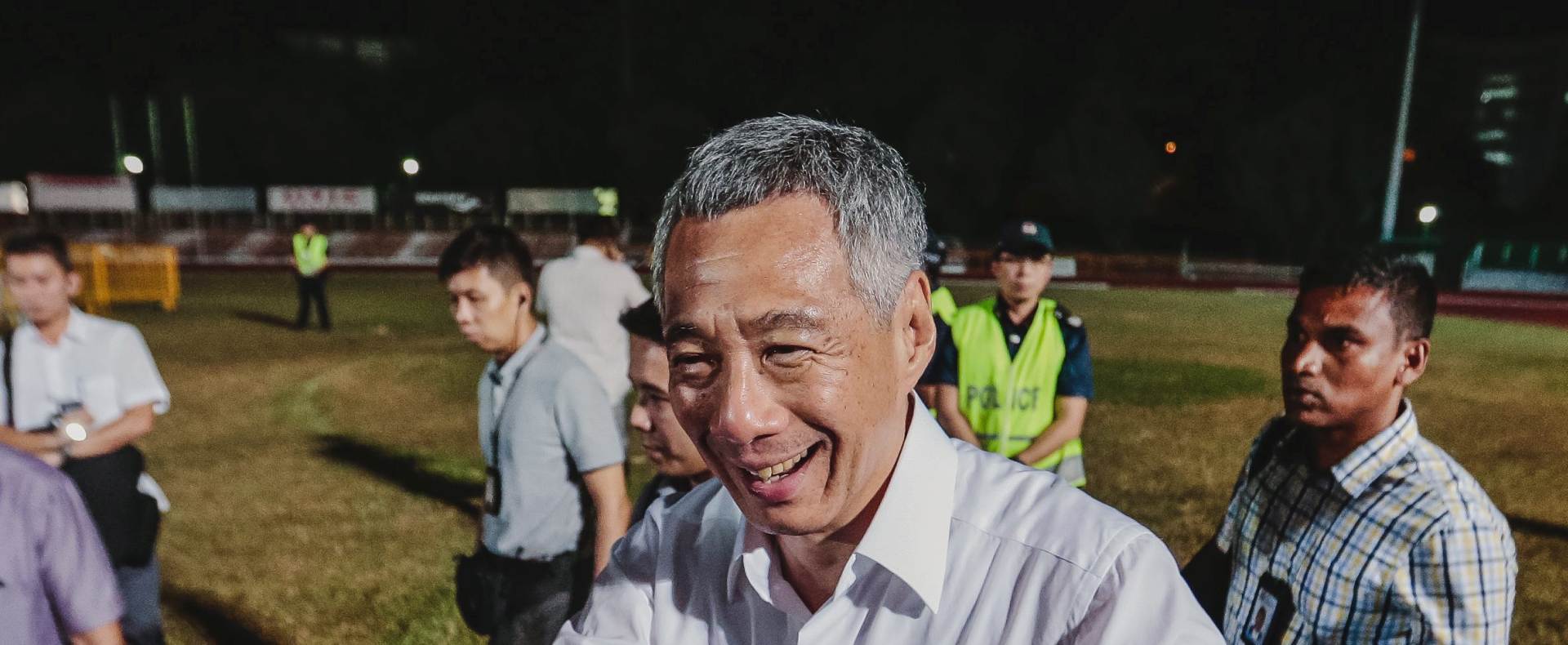 epa04925674 Singapore Prime Minister and secretary general of the ruling People's Action Party (PAP) Lee Hsien Loong arrives at the Toa Payoh stadium where supporters have gathered to hear the announcements of the results in the Singapore General election, 11 September 2015. All 89 seats in Singapore's Parliament were contested in the 11 September 2015 general elections, for the first time in the country's history as an independent state. The People's Action Party (PAP) is returned to government with gains in many constituencies.  EPA/WALLACE WOON
