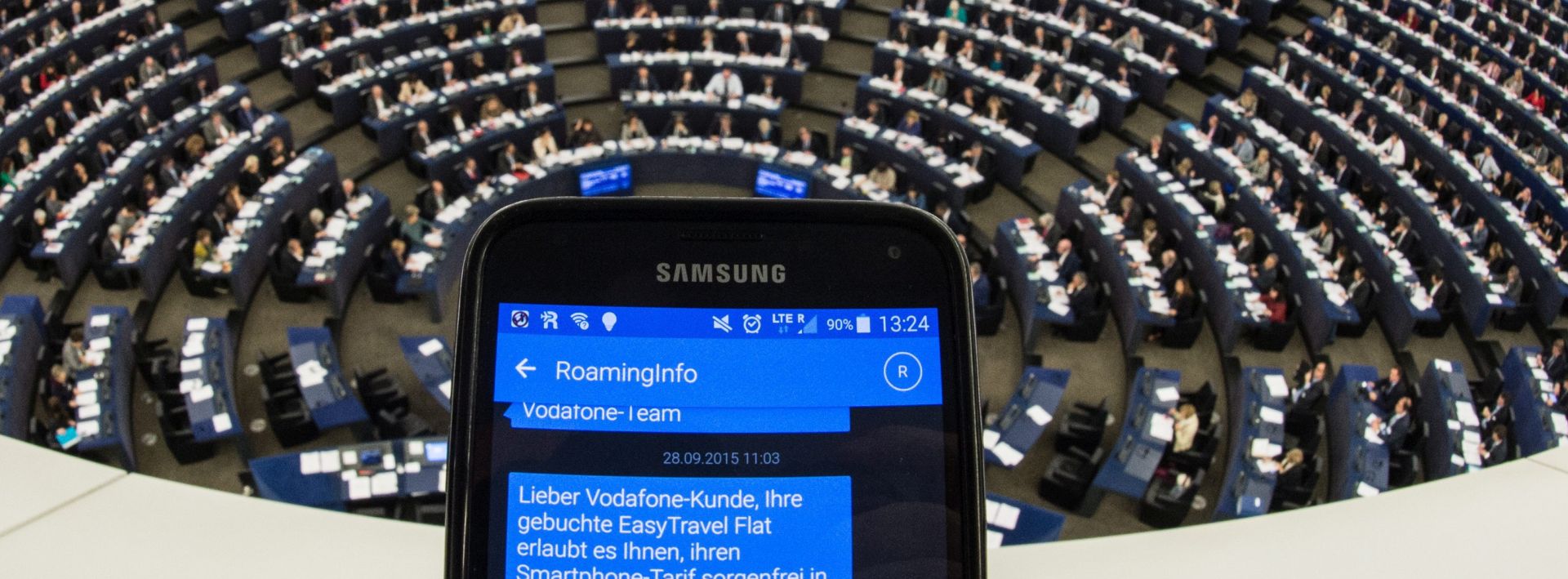 epa04998455 A hand holds a mobile phone showing SMS roaming information in the European Parliament in Strasbourg, France, 27 October 2015. Members of the European Parliament were voting on whether to scrap data roaming charges within the EU for mobile phone users.  EPA/PATRICK SEEGER