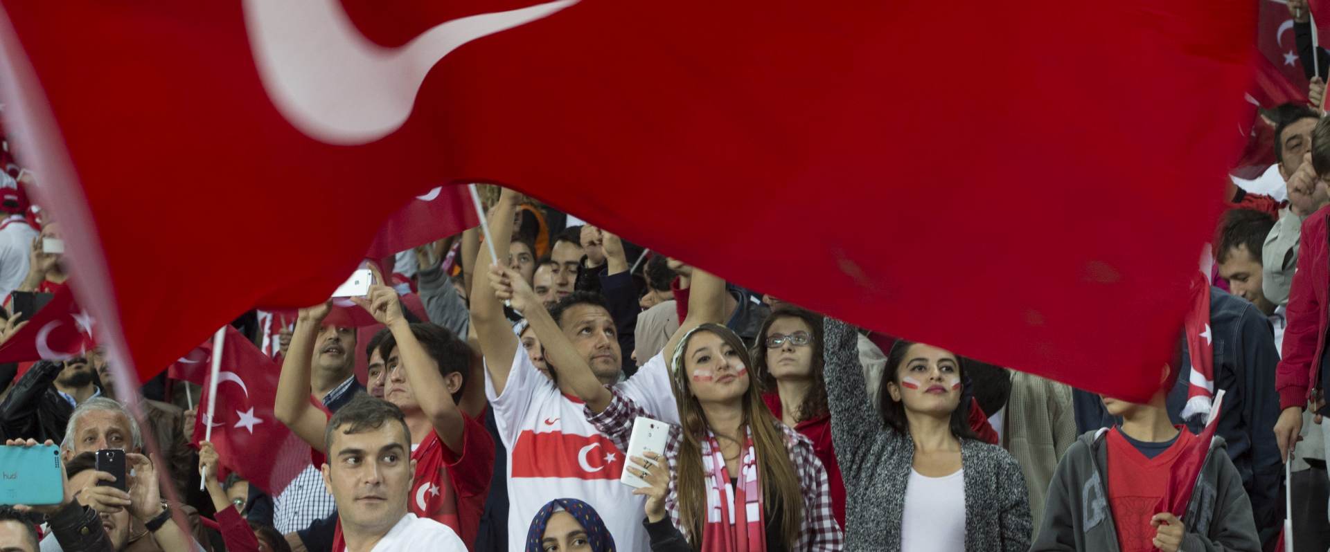 epa04976645 Turkish supporters cheer on their team  during the UEFA EURO 2016 group A qualifying match between Turkey and lceland in Konya, Turkey, 13 October 2015.  EPA/TOLGA BOZOGLU