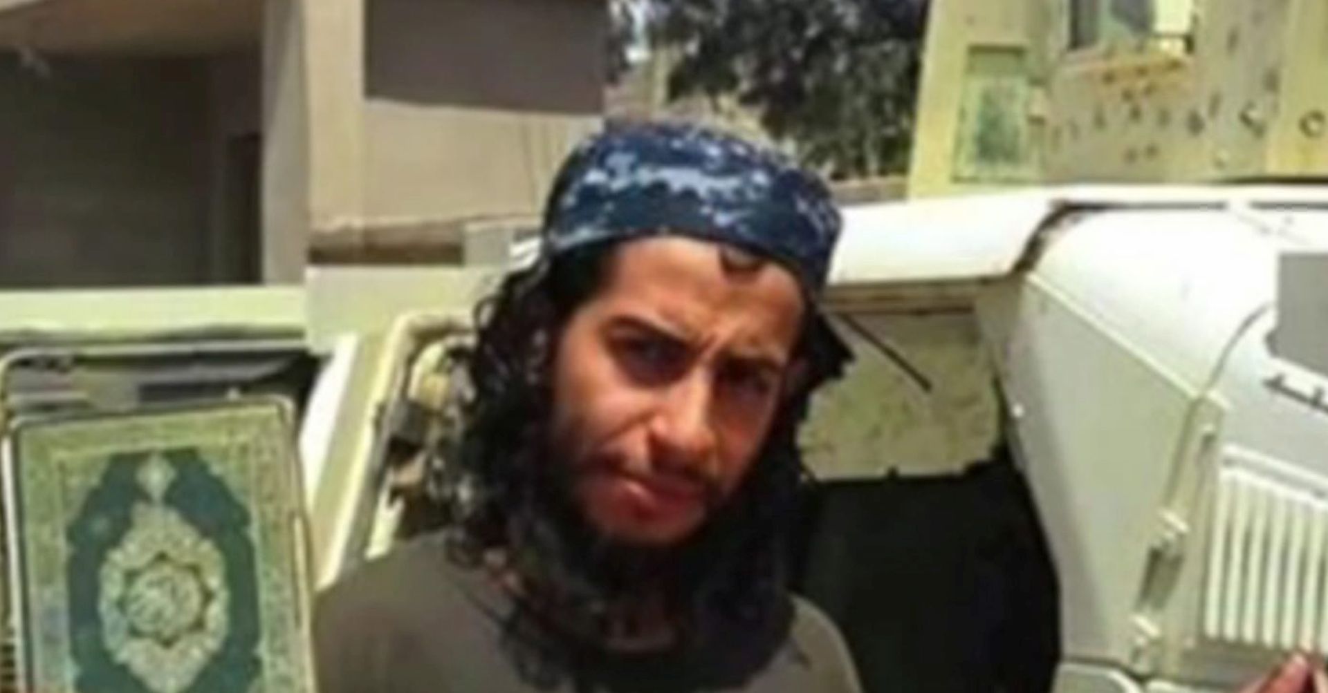 epa05032536 A framegrab made from an undated video released by the jihadist group calling itself Islamic State (IS) allegedly showing Abdelhamid Abaaoud posing with a Koran and the ISIS flag at an undisclosed location. According to French officials, Belgian-born Abdelhamid Abaaoud was identified as among those killed in the police raids in Saint Denis November 18.  EPA/ BEST QUALITY AVAILABLE. ATTENTION EDITORS : EPA IS USING AN IMAGE FROM AN ALTERNATIVE SOURCE AND CANNOT PROVIDE CONFIRMATION OF CONTENT, AUTHENTICITY, PLACE, DATE AND SOURCE. HANDOUT EDITORIAL USE ONLY/NO SALES HANDOUT EDITORIAL USE ONLY/NO SALES