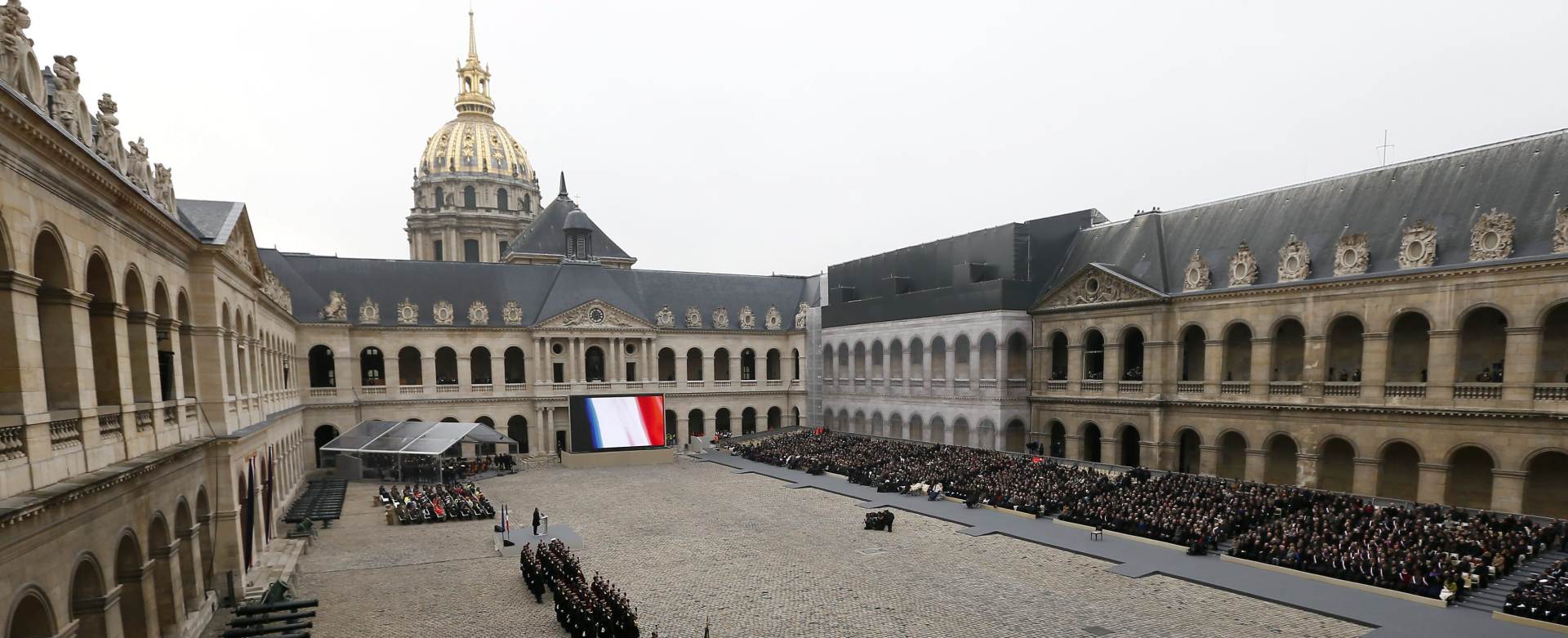 epa05044023 General view of the national memorial service to pay homage to the victims of the November 13 terrorist attacks, in the courtyard of the Invalides complex, in Paris, France, 27 November 2015. At least 130 people were killed and hundreds injured in the terror attacks which targeted the Bataclan concert hall, the Stade de France national sports stadium, and several restaurants and bars in the French capital on 13 November 2015.  EPA/IAN LANGSDON