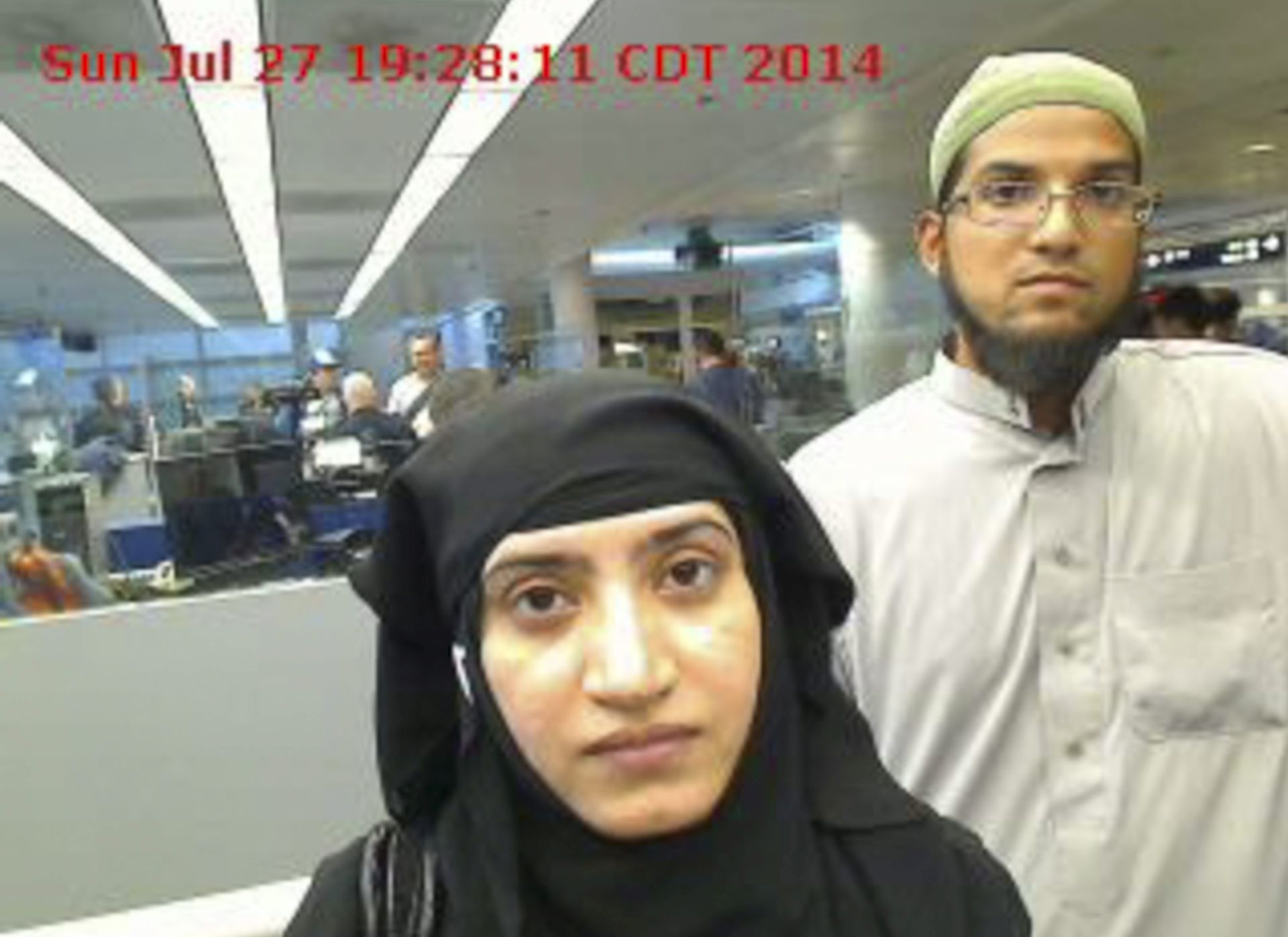 epa05058852 A photograph provided by US Customs and Border Protection (CBP) on 07 December 2015 shows Syed Rizwan Farook (R) and Tashfeen Malik (L) arriving at O'Hare International Airport in Chicago, Illinois, USA, on 27 July 2014. The couple have been identified by authorities as having killed 14 people and and wounded 21 others in a shooting in San Bernardino, California, USA, before being killed in a shootout with police.  EPA/US CUSTOMS AND BORDER PROTECTION / HANDOUT  HANDOUT EDITORIAL USE ONLY/NO SALES