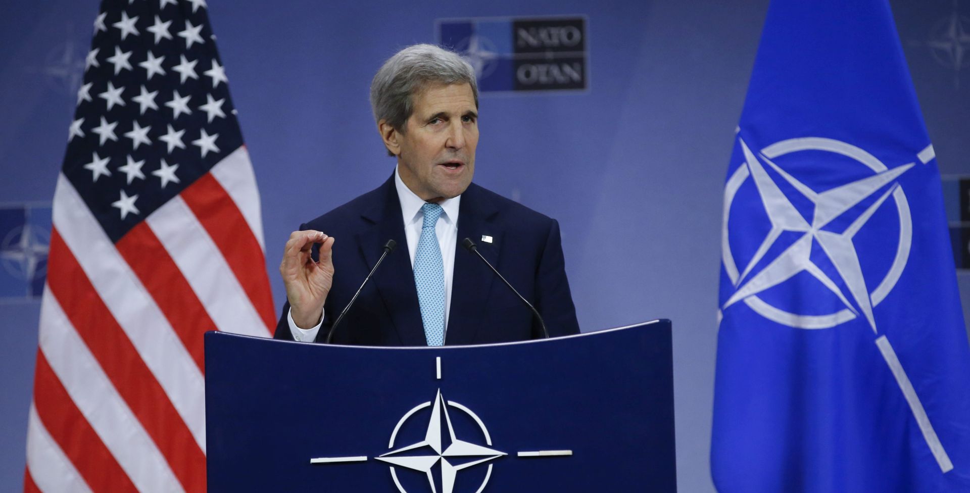 epa05051544 US Secretary of State John Kerry gestures stresses a point while speaking at a news conference following a NATO Foreign ministers meeting at the North Atlantic Treaty Organization's (NATO) headquarters in Brussels, Belgium, 02 December 2015. NATO foreign ministers earlier this morning had decided to invite Montenegro to become the 29th member of the NATO alliance.  EPA/OLIVIER HOSLET