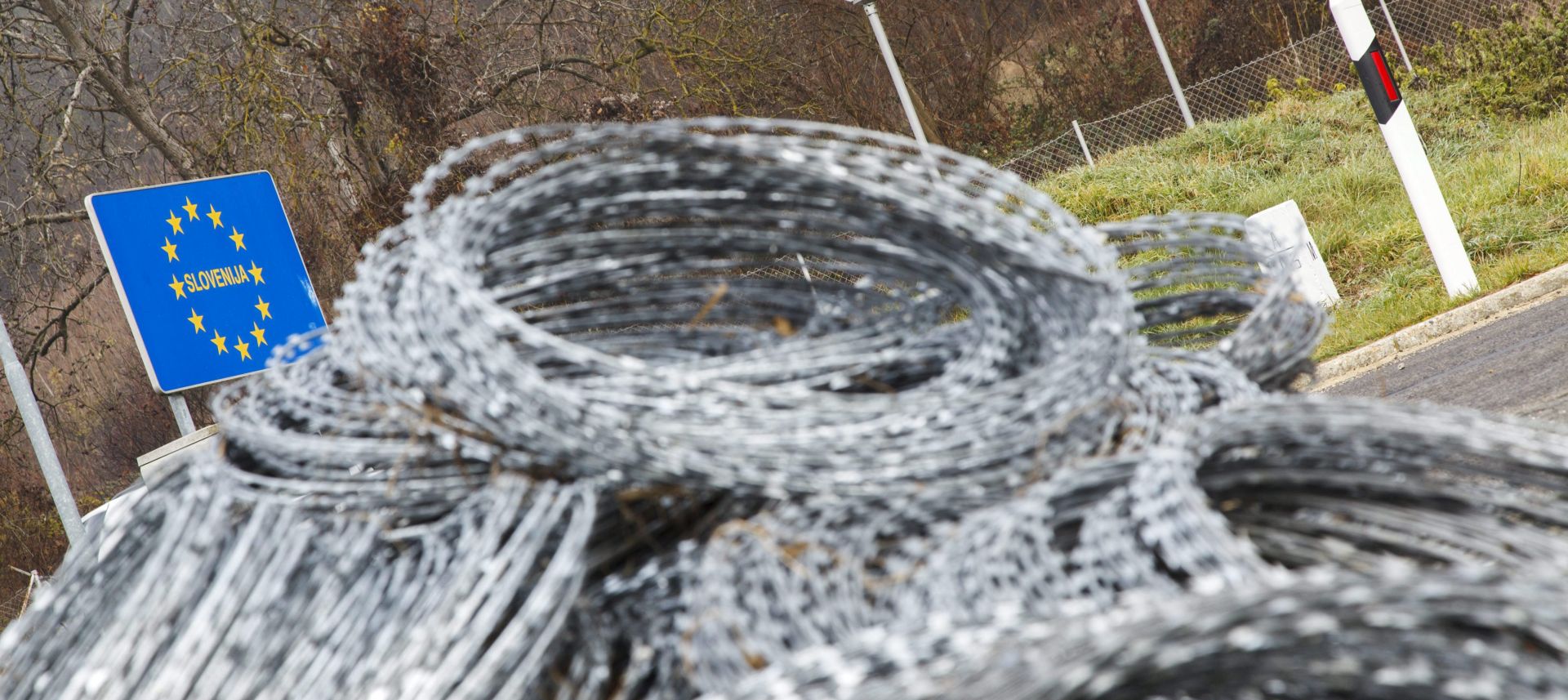 epa05053348 Coils of razor wire by a road on the Hungarian side of the Hungarian-Slovenian border near Tornyiszentmiklos, 258 kms southwest of Budapest, Hungary, 03 December 2015. The razor wire will be used by Hungarian authorities to install a fence along the border.  EPA/GYORGY VARGA HUNGARY OUT