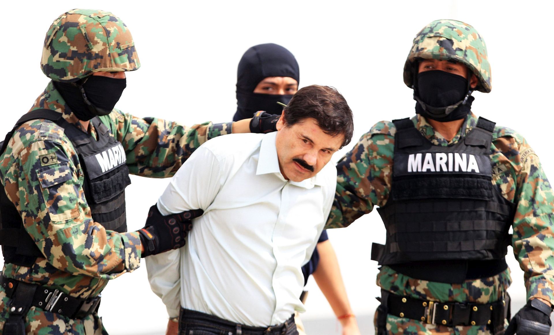 epa05093160 (FILE) Undated file picture taken to Mexican drug lord Joaquín "El Chapo" Guzman, after been recaptured in 2014, and presented by the authorities, in Mexico City. Mexican President, Enrique Peña Nieto, annouced the recapturing, on 08 January 2016, of Chapo Guzman, leader of the Sinaloa cartel, who was been fugitive from Justice after fleeding from a Mexican prision for a second time last 11 July 2015.  EPA/MARIO GUZMAN
