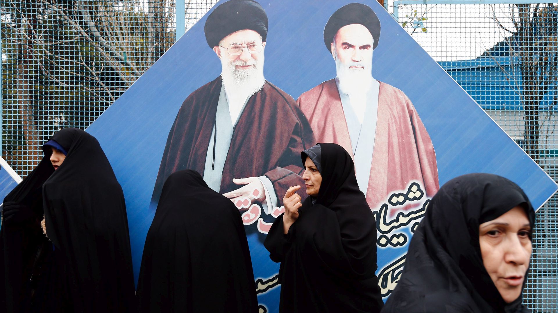 epa05092629 Iranian women stand in front of the huge pictures of Iranian late supreme leader Ayatollah Ruhollah Khomeini (Top-R) and Iranian supreme leader Ayatollah ali Khamenei (Top-L) during an anti-Saudi Arabia demonstration after weekly Friday Prayer ceremony in Tehran, Iran, 08 January 2016. Relations between Riyadh and Tehran were further soured this week when Iran condemned Saudi Arabia's execution of Shiite Sheikh Nimr al-Nimr, a fiery critic of the kingdom's Sunni authorities. The execution of al-Nimr on 02 January has led to protests by Shiite Muslims across the region.  EPA/ABEDIN TAHERKENAREH