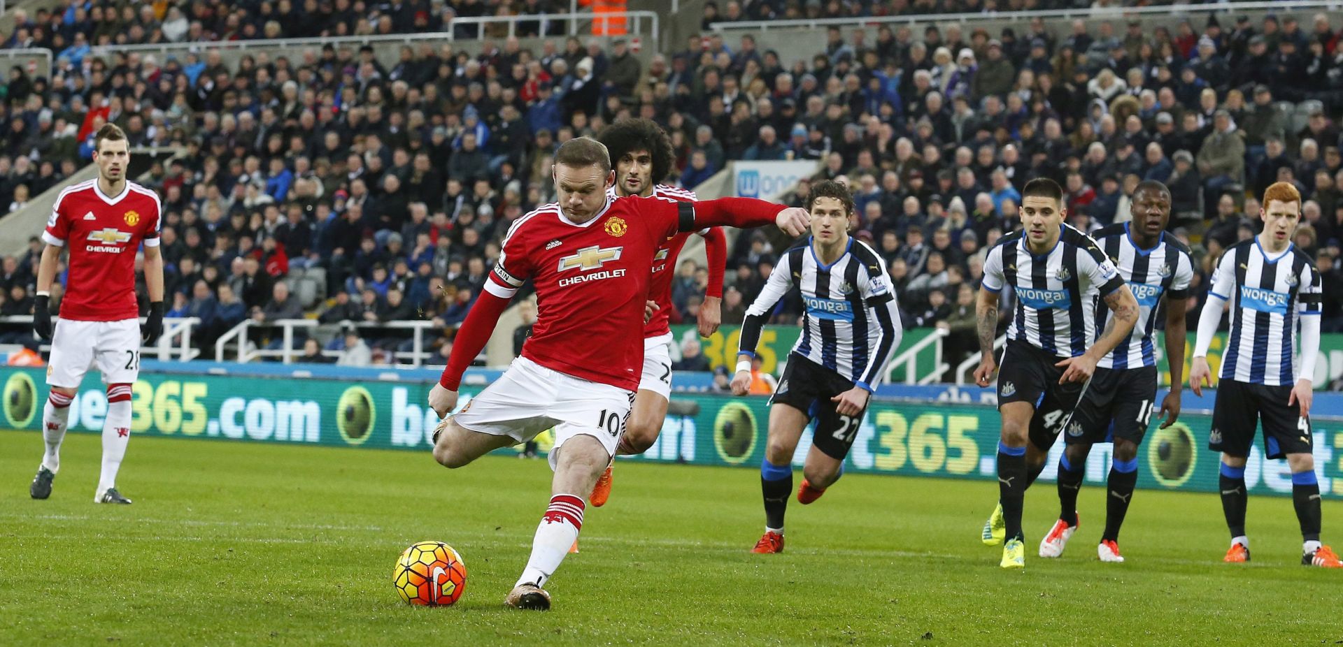 epa05099020 Manchester United's Wayne Rooney scores a penalty during the English Premier League soccer match between Newcastle United and Manchester United at St James' Park in Newcastle, Britain, 12 January 2016.  EPA/LINDSEY PARNABY DataCo terms and conditions apply http//www.epa.eu/downloads/DataCo-TCs.pdf