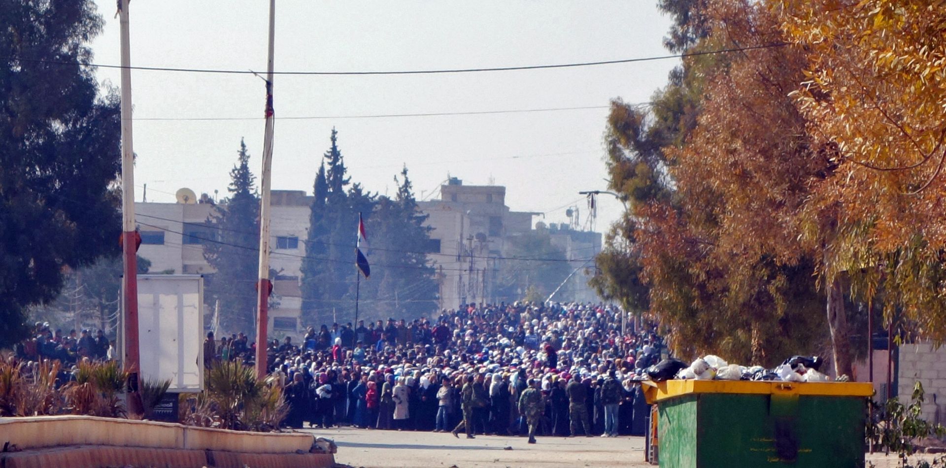 epa05142737 A handout photo dated 03 February 2016 and made available 04 February 2016 by International Committee of the Red Cross, ICRC, showing a crowd of people waiting on the edge of a buffer zone that was created in preparation for a food aid distribution in the besieged town of Moadamiyeh, Syria. The aid distribution  was a joint operation between the Syrian Arab Red Crescent (SARC) and the International Committee of the Red Cross (ICRC). UN Secretary General Ban Ki-moon urged the international community 04 February 2016 to foster political dialogue to alleviate the 'intolerable suffering' of Syrians, as some 70 nations gathered in London to pledge financial support to the war-torn country.  EPA/PAWEL KRZYSIEK / HANDOUT  HANDOUT EDITORIAL USE ONLY/NO SALES