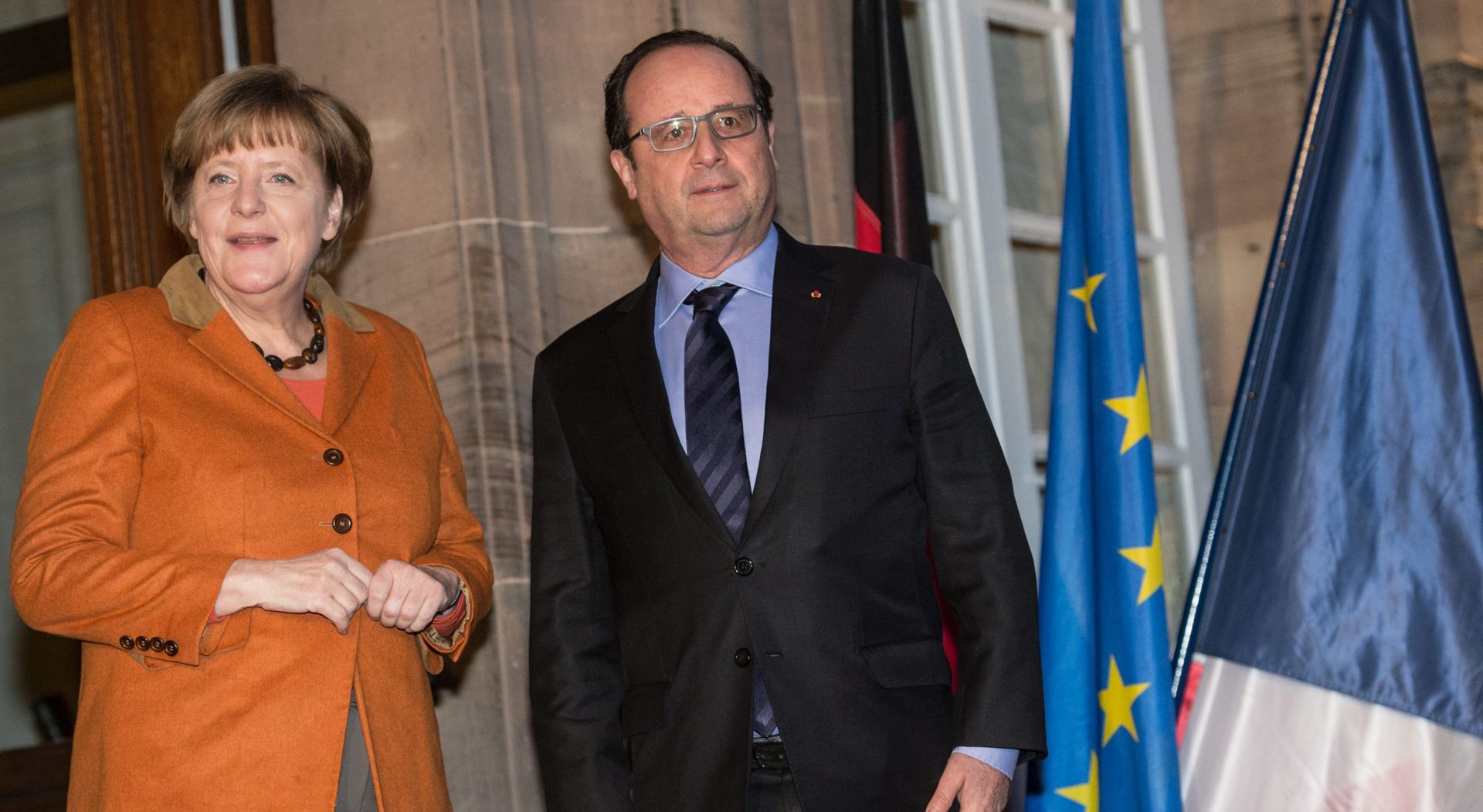 epa05148259 French President Francois Hollande (R) and German Chancellor Angela Merkel (L) prepare for their meeting at the Prefecture in Strasbourg, France, 07 February 2016. Hollande, Merkel and European Parliament President Martin Schulz are meeting for talks in Strasbourg on the eve of Merkel's visit to Ankara, Turkey, as part of her bid to curb migration to Europe.  EPA/PARTICK SEEGER / POOL MAXPPP OUT