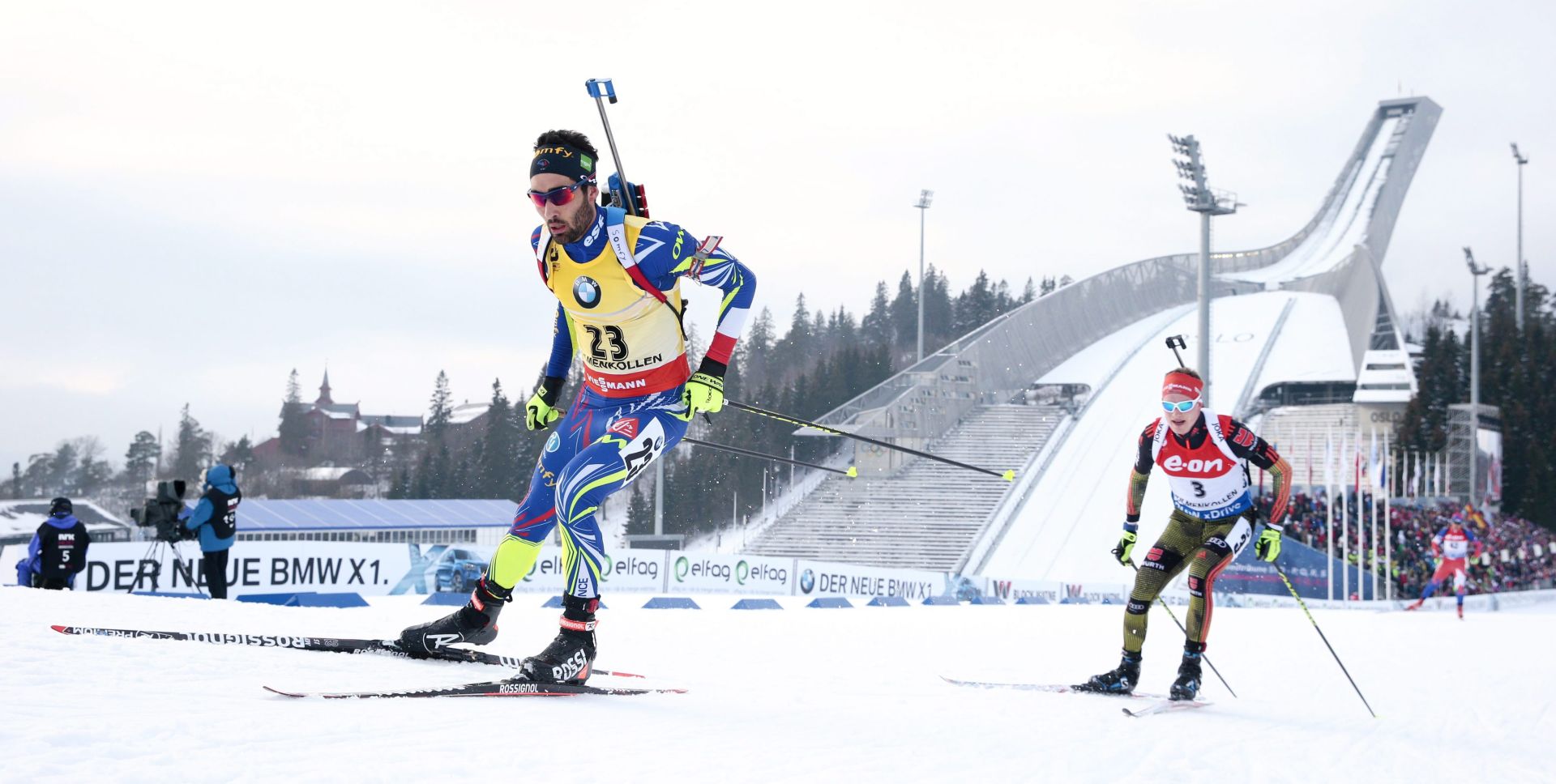 epa05204480 Martin Fourcade (L) of France and Benedikt Doll (R) of Germany compete in the men's Individual 20km race for the IBU Biathlon World Championships in Oslo, Norway, 10 March 2016.  EPA/HAKON MOSVOLD LARSEN **NORWAY OUT**