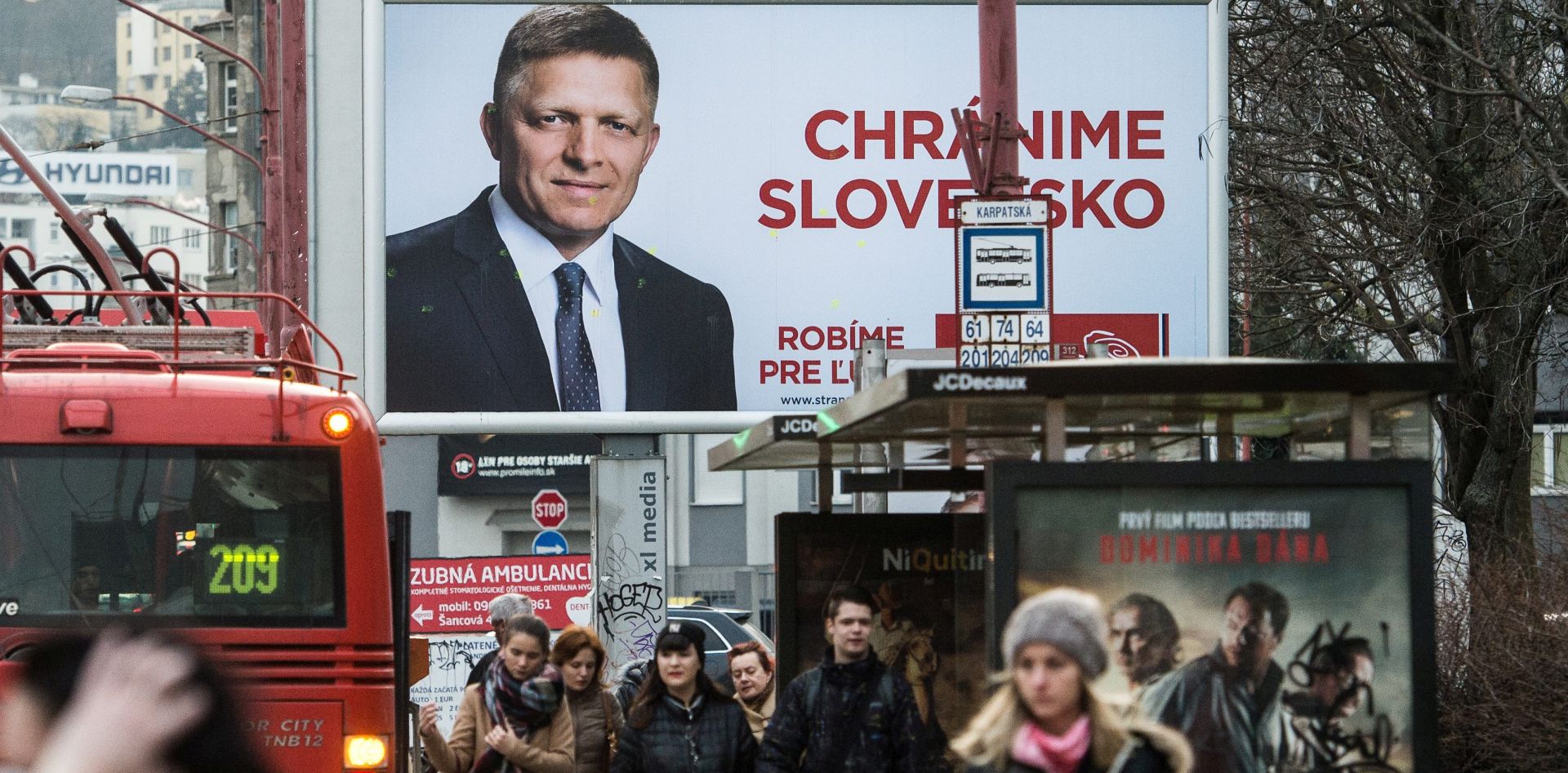 epa05194739 Election poster of 'Direction - Social Democracy' party SMER with Slovakian Prime Minister and SMER leader Robert Fico reading 'We defend Slovakia' pictured in Bratislava, Slovakia, 04 March 2016. Parliamentary elections in Slovakia will be held on 05 March 2016.  EPA/FILIP SINGER