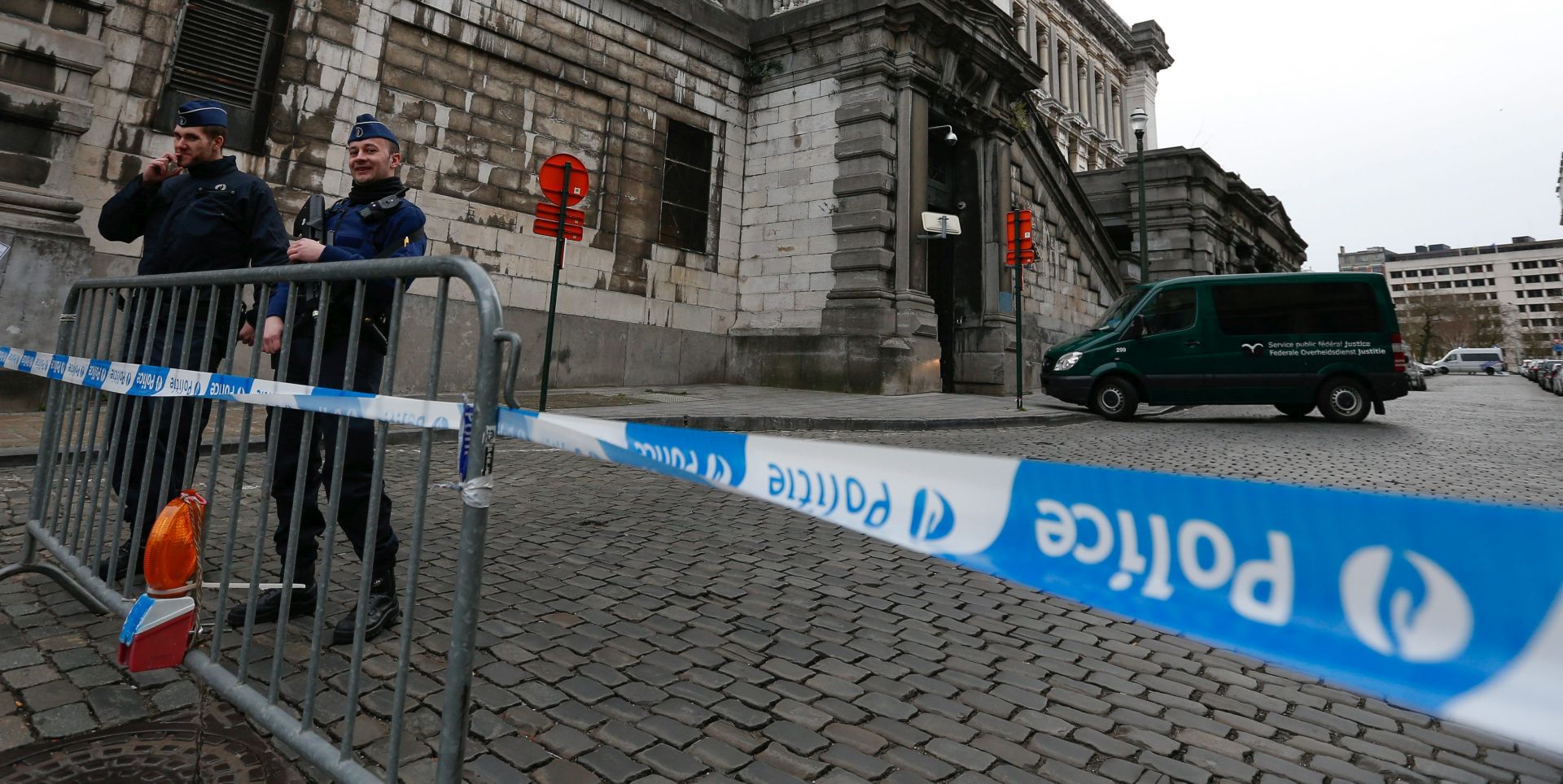 epa05235953 Police guards the entrance of the Brussels Council Chamber building as a police van believed to carry two terrorist suspects for a hearing, in Brussels, Belgium, 30 March 2016. The two men, identified only as Abderamane A. and Rabah N. by the federal prosecution have been arrested on 25 March during raids in Brussels connected to investigations into a foiled attack in France. The court will rule on their detention although France has not yet issued a European arrest warrant against them.  EPA/LAURENT DUBRULE
