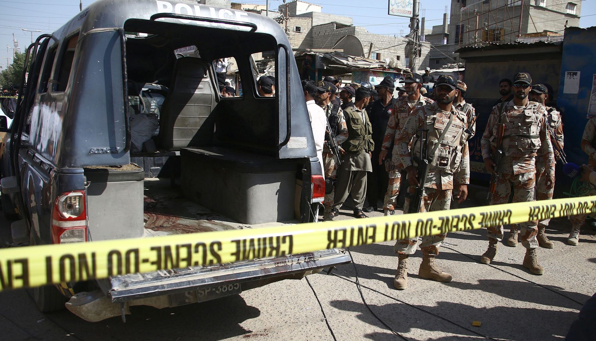 epa05268633 Pakistani security officials stand guard beside a Police vehicle that was targeted by unknown gunmen in Karachi, Pakistan, 20 April 2016.  At least seven policemen were on security duty to Polio vaccination team were killed by unknown gunmen in Karachi. Pakistan is one of the last two countries -along with Afghanistan- where the polio is still endemic, meaning infections occur within the local population or within a particular area. Though new polio cases dropped to a nine-year low in 2015, attacks by Islamist militants against health workers and police guarding them remained a challenge for a UN-funded vaccination campaign. Only 51 children were found infected with the crippling virus in 2015 compared to 306 a year earlier in what officials said a major achievement due to the success of a military offensive.  EPA/SHAHZAIB AKBER