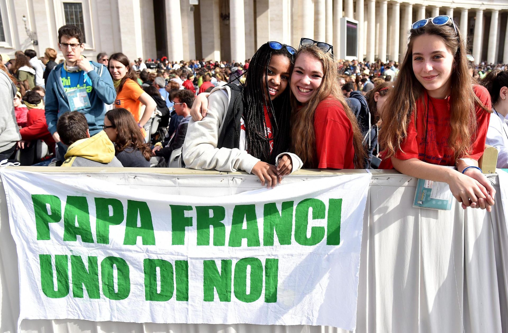 epa05274724 Young pilgrims display a banners that says; 'Pope Francis One of us' as they attend a mass for the Youth Jubilee in Saint Peters Square, Vatican City, 24 April 2016.  EPA/ETTORE FERRARI