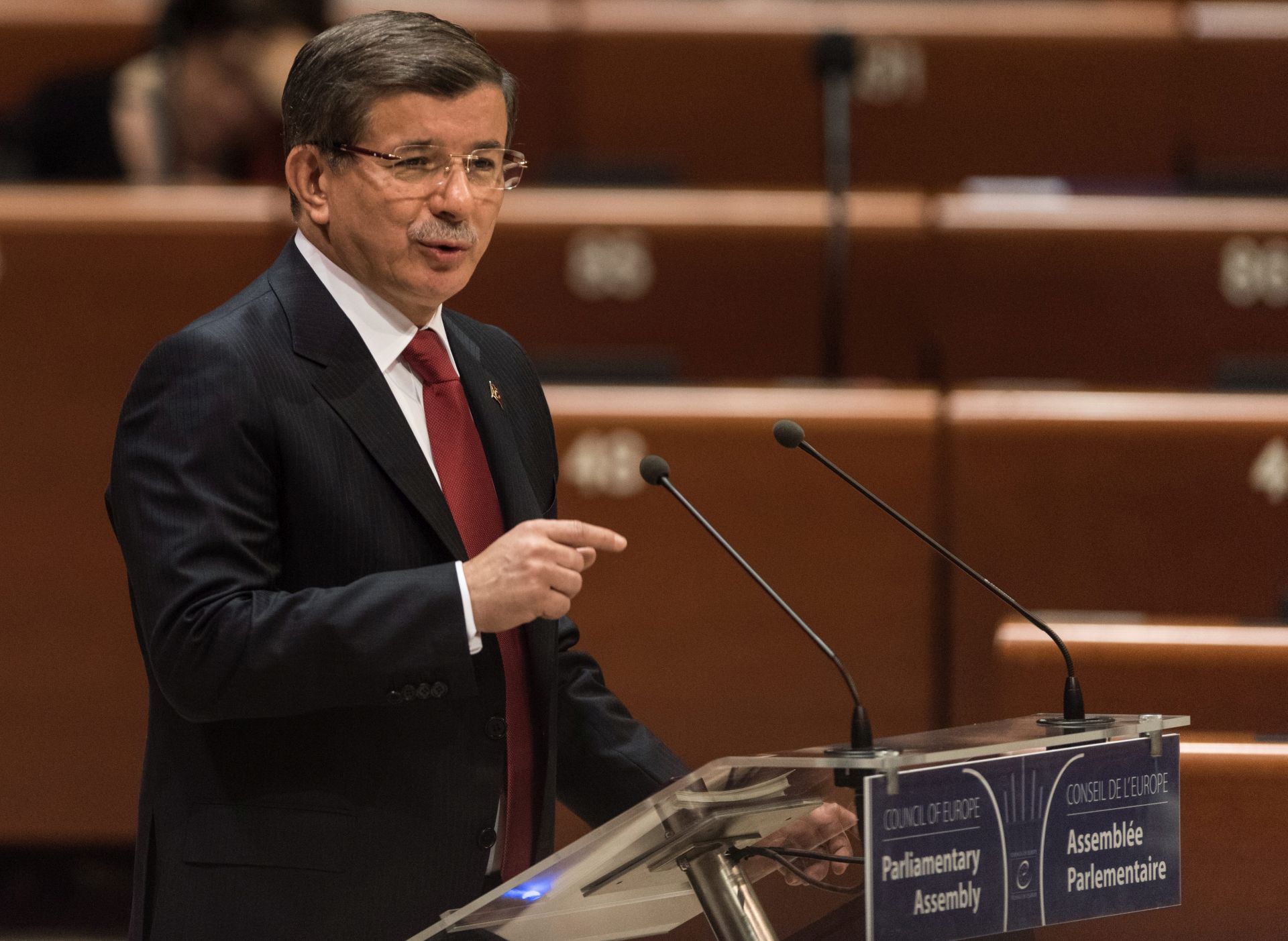 epa05266746 Ahmet Davutoglu, Prime Minister of Turkey delivers his speech to the Council of Europe in Strasbourg, France, 19 April 2016.  EPA/PATRICK SEEGER