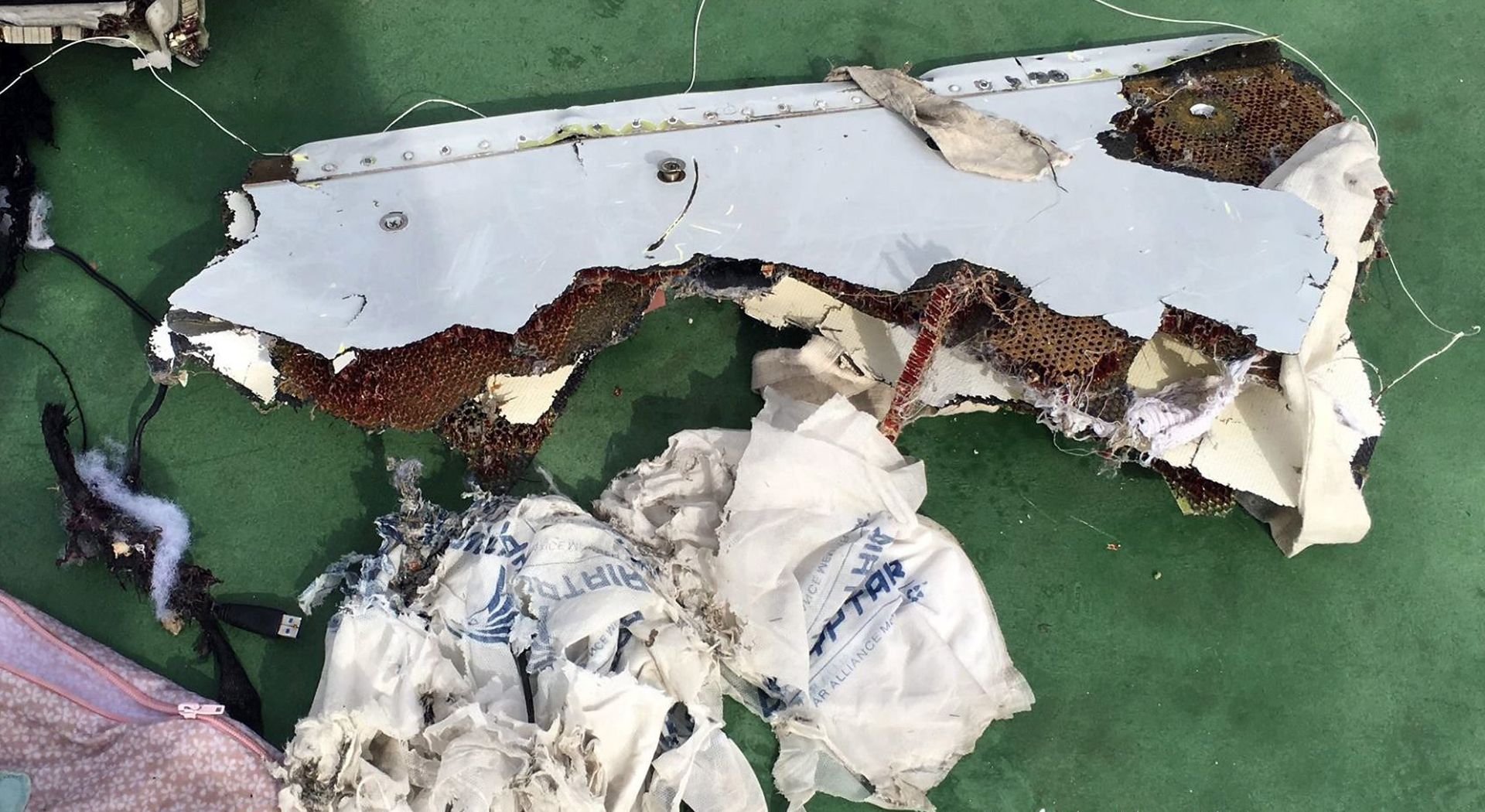 epa05320978 A handout picture made available by the Egyptian Defence Ministry showing pieces of debris from the EgyptAir MS804 flight missing at sea, unspecified location in Egypt, 21 May 2016. The Armed Forces of Egypt announced that the debris of an EgyptAir Airbus A320, which had disappeared early on 19 May 2016, as well as personal belongings of the passengers are floating in the Mediterranean Sea, north of the Egyptian city of Alexandria. The EgyptAir passenger jet had left Paris bound for Cairo with 66 people on board, but crashed into the Mediterranean Sea for unknown reasons.  EPA/EGYPTIAN DEFENCE MINISTRY / HANDOUT  HANDOUT EDITORIAL USE ONLY/NO SALES