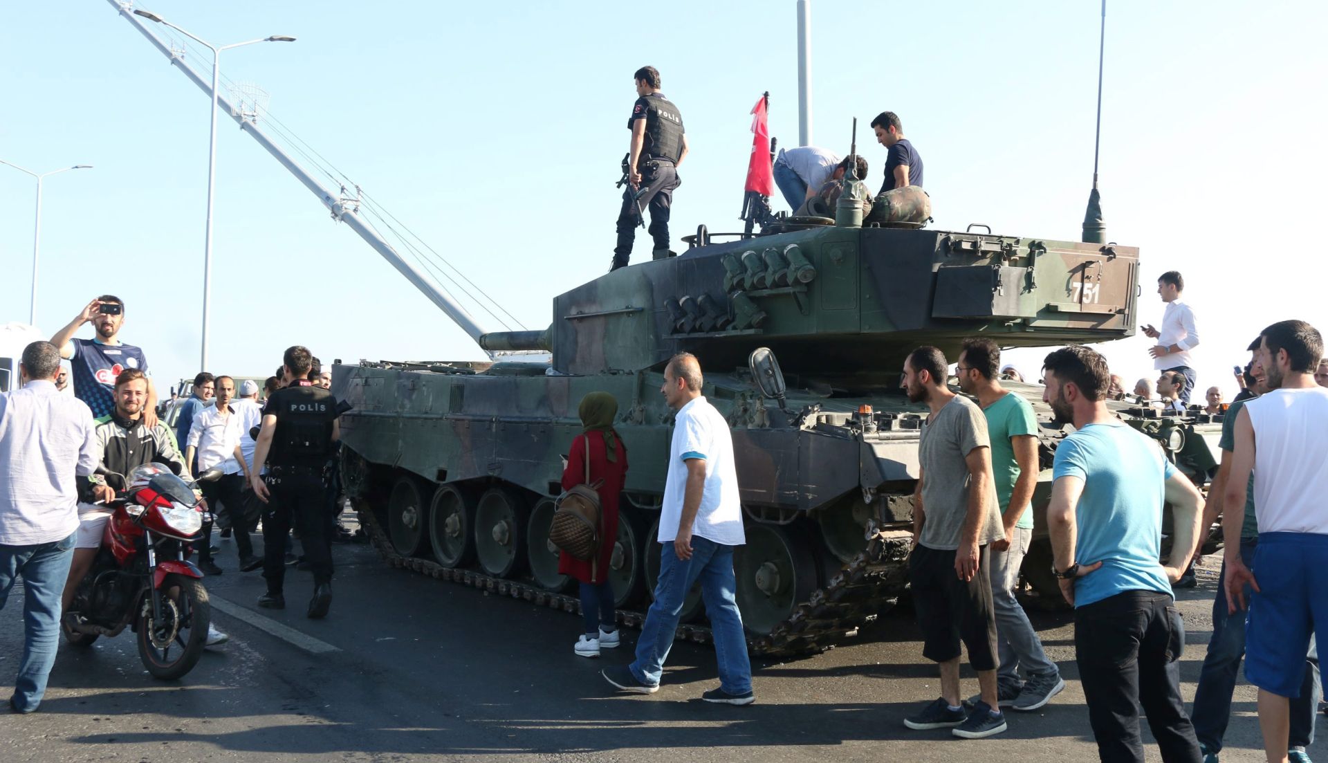 epa05427493 Turkish police and supporters of President Recep Tayyip Erdogan gather around a military tank on the Bosphorus Bridge after a failed coup attempt, in Istanbul, Turkey, 16 July 2016. Turkish Prime Minister Yildirim reportedly said that the Turkish military was involved in an attempted coup d'etat. The Turkish military meanwhile stated it had taken over control. According to news reports, Turkish President Recep Tayyip Erdogan has denounced the coup attempt as an 'act of treason' and insisted his government remains in charge. Some 104 coup plotters were killed, 90 people - 41 of them police and 47 are civilians - 'fell martrys', after an attempt to bring down the Turkish government, the acting army chief General Umit Dundar said in a televised appearance.  EPA/STR