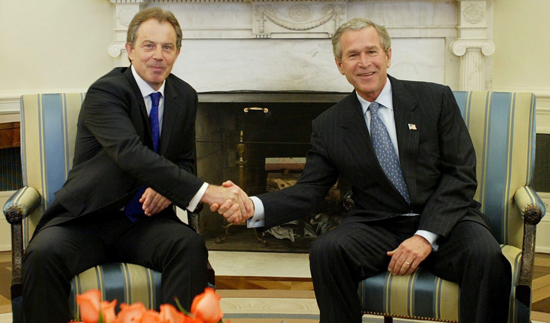 epa05410203 (FILE) A file photo dated 16 April 2004 showing then US President George W. Bush (R) shaking hands with then British Prime Minister Tony Blair in the Oval Office at the White House, Washington, USA. The report by Sir John Chilcot on whether it was right and neccessary to invade Iraq concluded 06 July 2016 the invasion and subsequent war against Iraq was 'not the last resort'. Chilcot also said US and British policy on Iraq based on 'flawed intelligence and assessments'.  EPA/SHAWN THEW