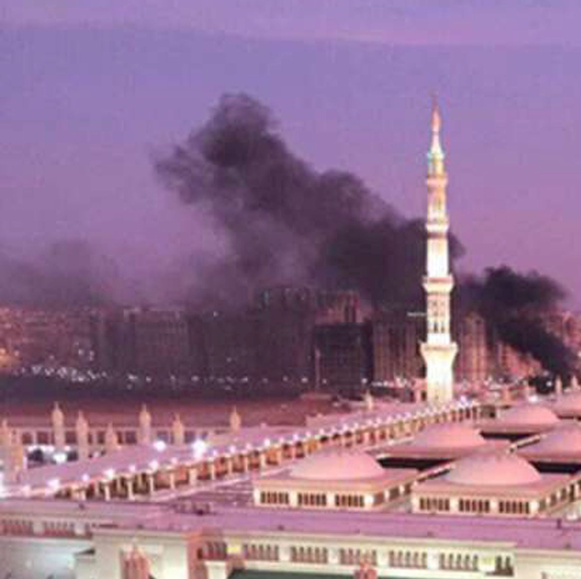 epa05407976 A handout photograph made available by the Saudi Press Agency (SPA) on 04 July 2016 shows the Prophet Mohammed Mosque with smoke rising in the background in the holy city of Medina, in Saudi Arabia, 04 July 2016. Media reports state that an apparent suicide bomber detonated a device at the second holiest site in Islam. Other explosions were also reported from sites in Jeddah and Qatif earlier the same day, which is the last day of the Muslim's Holy Month of Ramadan.  EPA/SAUDI PRESS AGENCY / HANDOUT HANDOUT EDITORIAL USE ONLY/NO SALES HANDOUT EDITORIAL USE ONLY/NO SALES