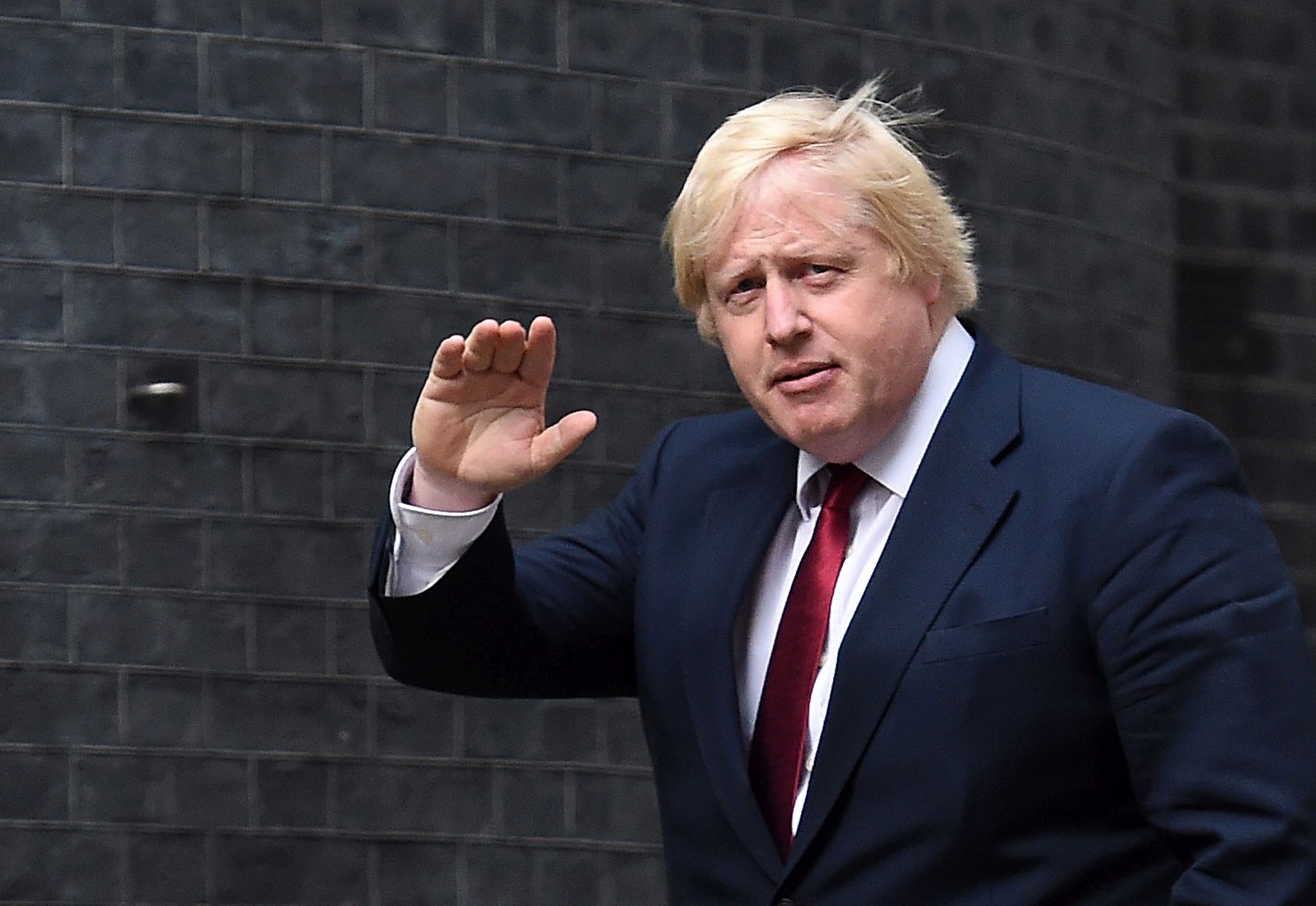epa05423642 New Foreign Secretary Boris Johnson arrives at No.10 Downing Street after being summoned by new British Prime Minister Theresa May in London, Britain, 13 July 2016. Theresa May has appointed Boris Johnson Foreign Secretary in her first Cabinet as Prime Minister.  EPA/ANDY RAIN