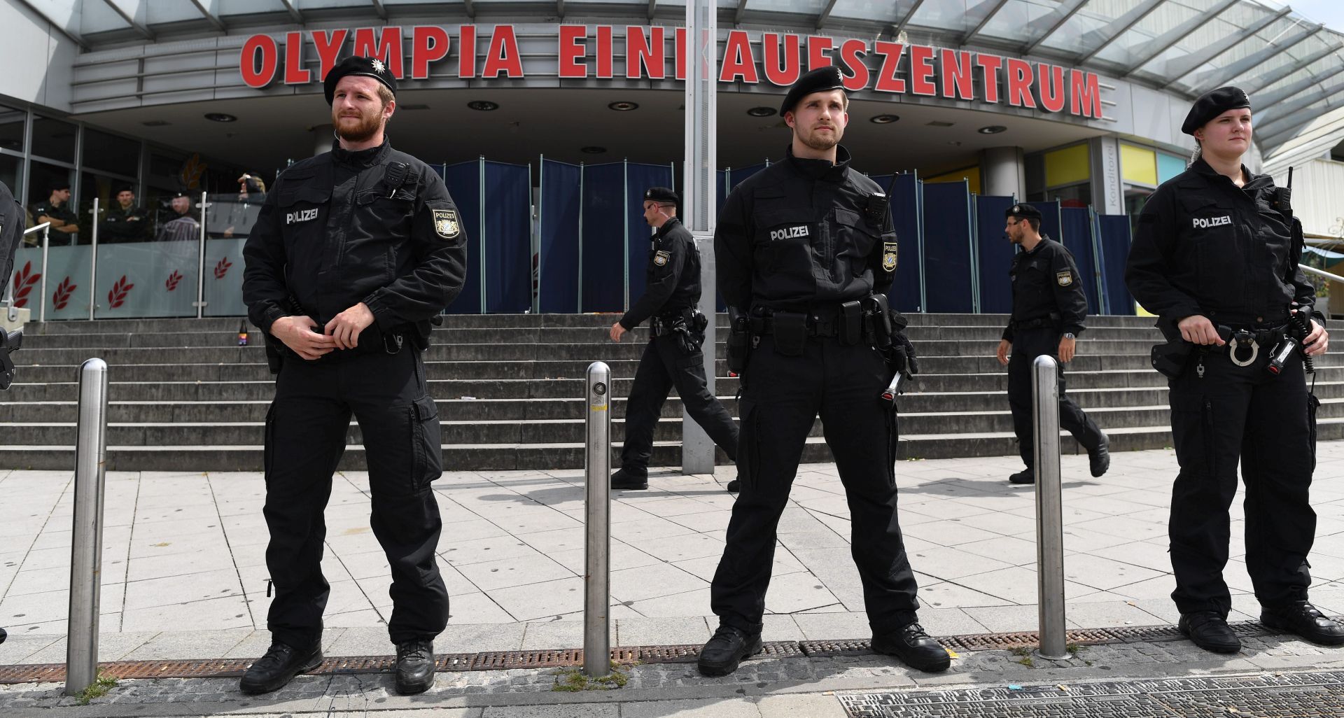 epa05437893 Police forces stand in front of the Olympia shopping center in Munich, Germany, 23 July 2016. According to authorities, at least 10 people died, including the suspect, after a shooting spree at the Olympia shopping centre in Munich on 22 July 2016. Police on 23 July 2016 said it was a 'classical amok run' by an 18-year-old Munich-born young man.  EPA/SVEN HOPPE