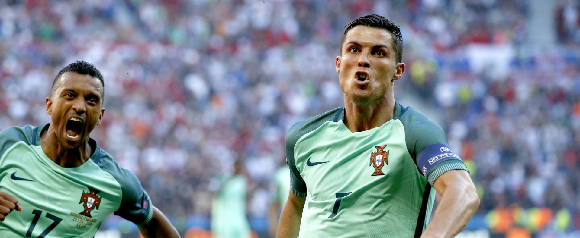 epa05384000 Cristiano Ronaldo of Portugal (R) celebrates scoring the 2-2 with Nani during the UEFA EURO 2016 group F preliminary round match between Hungary and Portugal at Stade de Lyon in Lyon, France, 22 June 2016.


(RESTRICTIONS APPLY: For editorial news reporting purposes only. Not used for commercial or marketing purposes without prior written approval of UEFA. Images must appear as still images and must not emulate match action video footage. Photographs published in online publications (whether via the Internet or otherwise) shall have an interval of at least 20 seconds between the posting.)  EPA/ROBERT GHEMENT   EDITORIAL USE ONLY