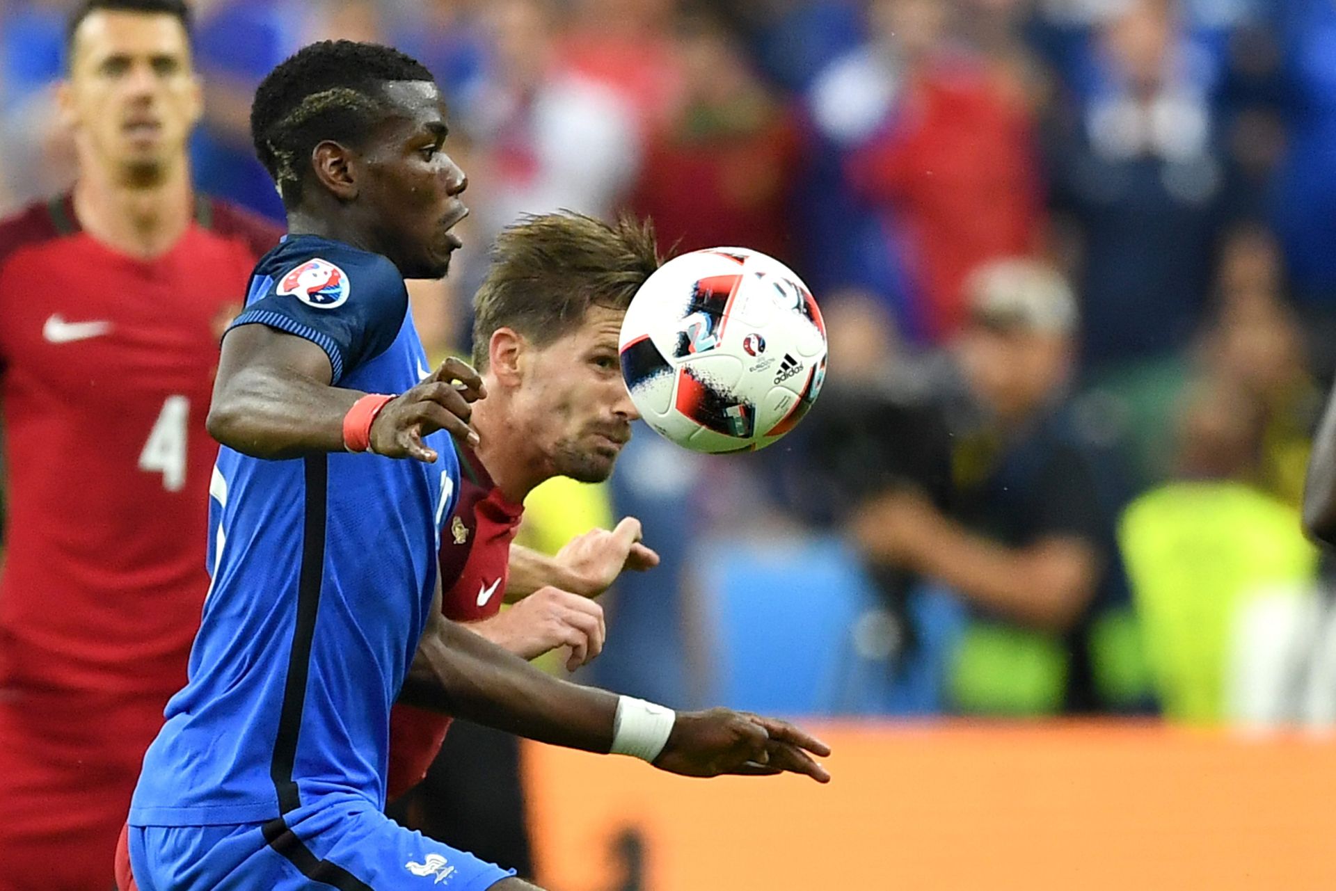 epa05419386 Paul Pogba (L) of France in action against Adrien Silva of Portugal during the UEFA EURO 2016 Final match between Portugal and France at Stade de France in Saint-Denis, France, 10 July 2016.


(RESTRICTIONS APPLY: For editorial news reporting purposes only. Not used for commercial or marketing purposes without prior written approval of UEFA. Images must appear as still images and must not emulate match action video footage. Photographs published in online publications (whether via the Internet or otherwise) shall have an interval of at least 20 seconds between the posting.)  EPA/GEORGI LICOVSKI   EDITORIAL USE ONLY