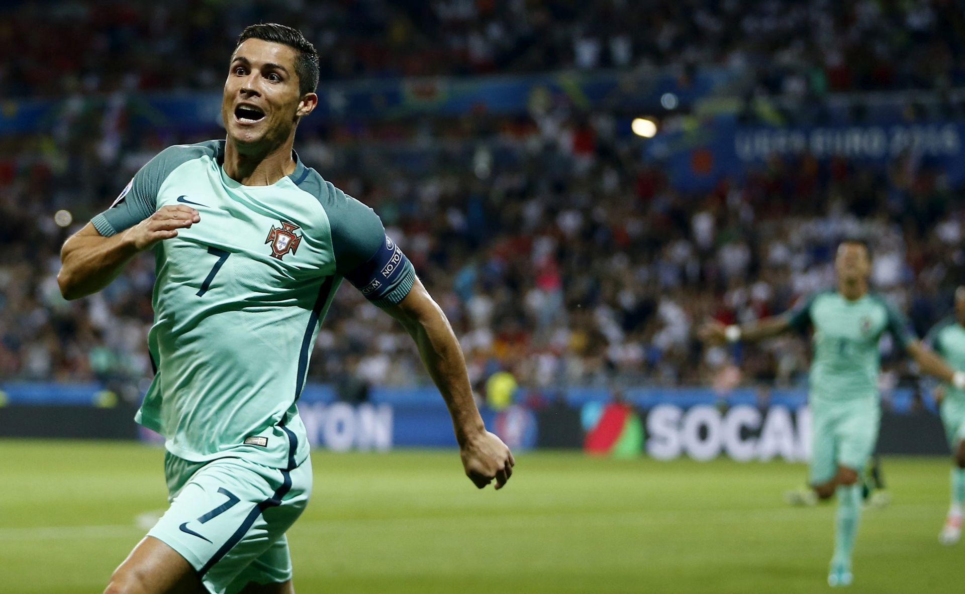 epa05411675 Cristiano Ronaldo of Portugal celebrates scoring the opening goal during the UEFA EURO 2016 semi final match between Portugal and Wales at Stade de Lyon in Lyon, France, 06 July 2016.

(RESTRICTIONS APPLY: For editorial news reporting purposes only. Not used for commercial or marketing purposes without prior written approval of UEFA. Images must appear as still images and must not emulate match action video footage. Photographs published in online publications (whether via the Internet or otherwise) shall have an interval of at least 20 seconds between the posting.)  EPA/ABEDIN TAHERKENAREH   EDITORIAL USE ONLY