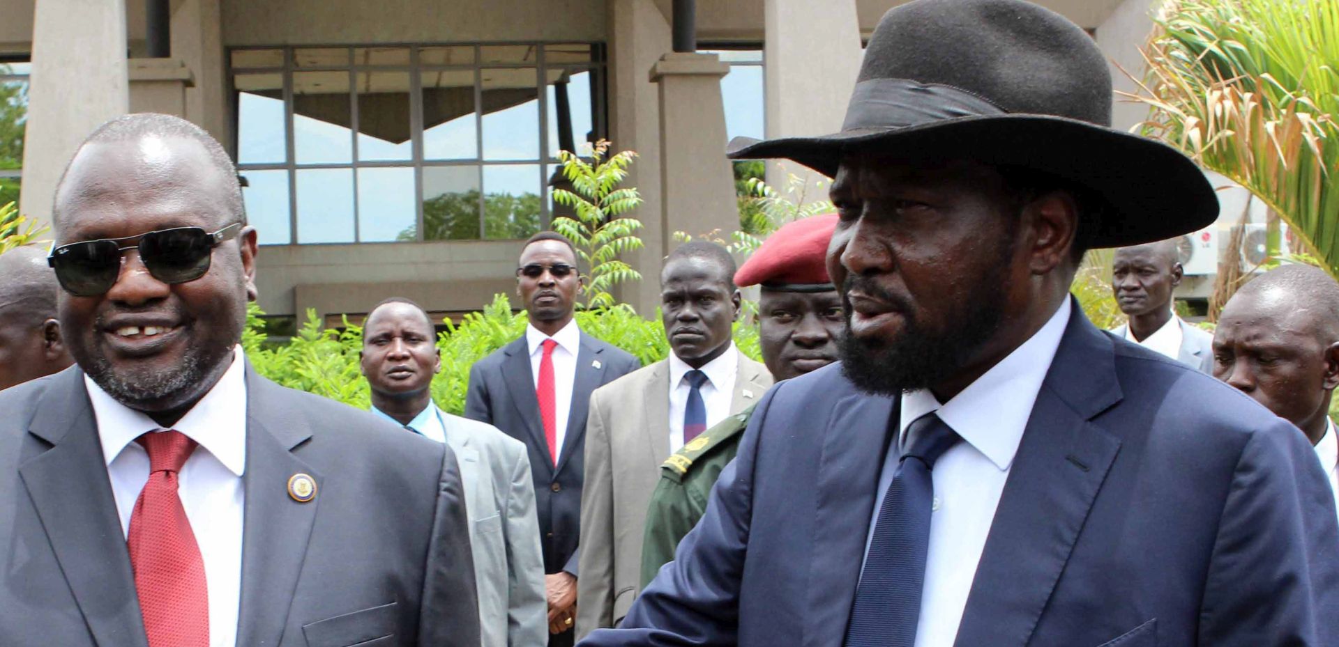 epa05418547 (FILE) A file photo dated 29 April 2016 shows South Sudan President Salva Kiir (R) shaking hands with former rebel leader and First Vice-President Riek Machar (L) after a new unity government was sworn-in, Juba, South Sudan. Reports on 10 July 2016 said hundreds were killed in two days of renewed fighting between supporters of President Salva Kiir and Vice-President Riek Machar. The UN Security Council condemned the fighting that erupted in Juba, the worst violence since a peace deal was signed in 2015 and forming the national unity government in April this year.  EPA/PHILLIP DHIL