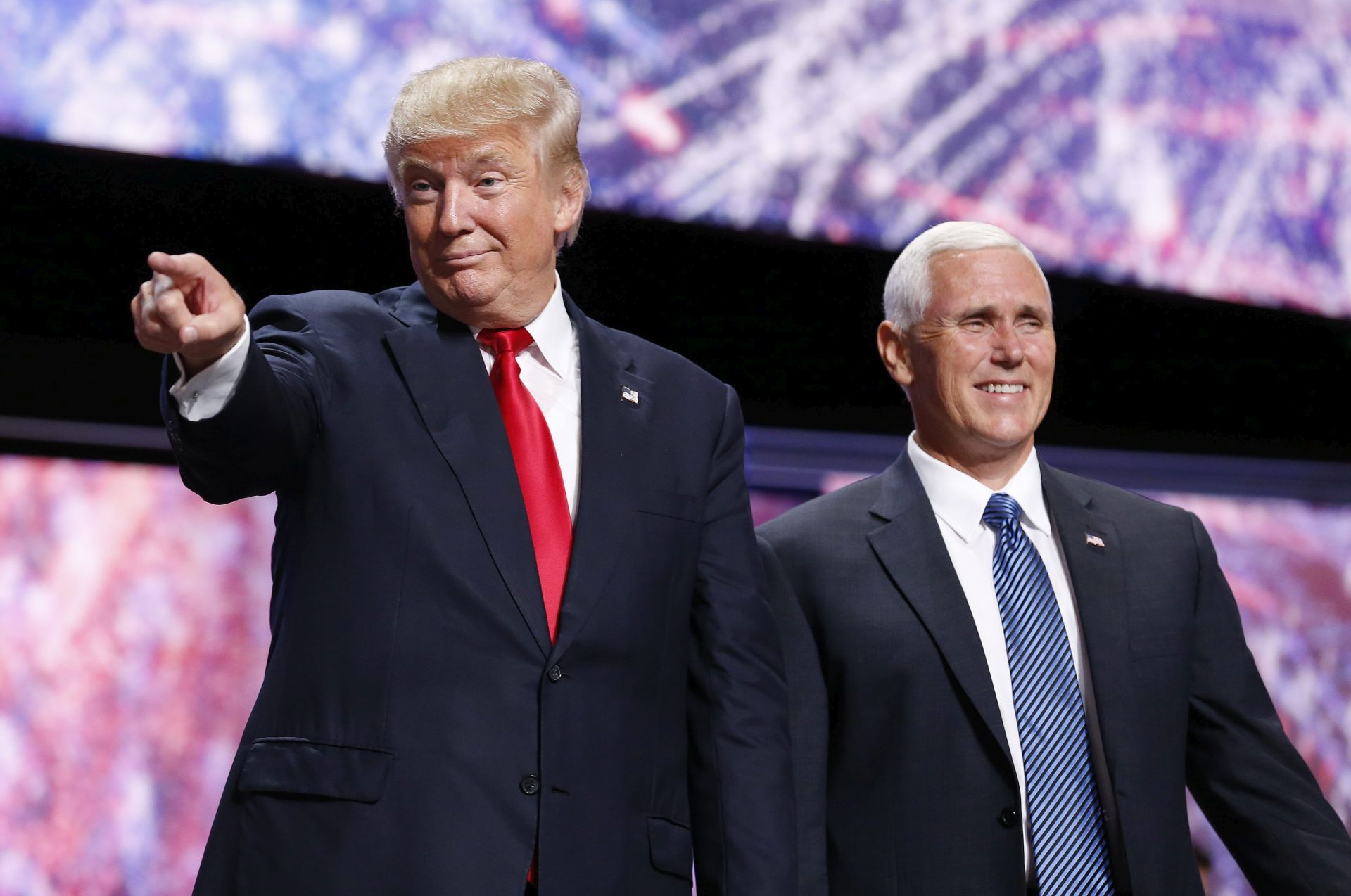 epa05436049 Republican Presidential nominee Donald Trump (L) and Vice Presidential nominee Mike Pence (R) during the final day of the 2016 Republican National Convention at Quicken Loans Arena in Cleveland, Ohio, USA, 21 July 2016.  Donald Trump formally accepted the nomination of the Republican Party as their presidential candidate in the 2016 election.  EPA/MICHAEL REYNOLDS