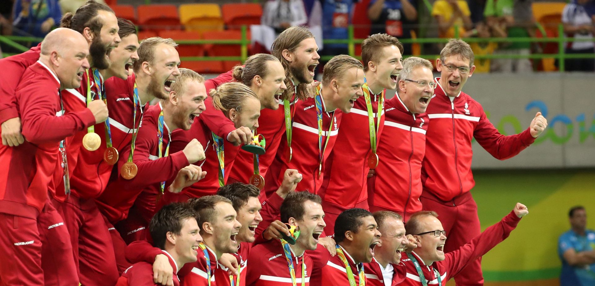 epa05505554 The Gold medal team of Denmark react during the awarding ceremony of the men's Handball tournament for the Rio 2016 Olympic Games at the Future Arena in the Olympic Park in Rio de Janeiro, Brazil, 21 August 2016.  EPA/SRDJAN SUKI