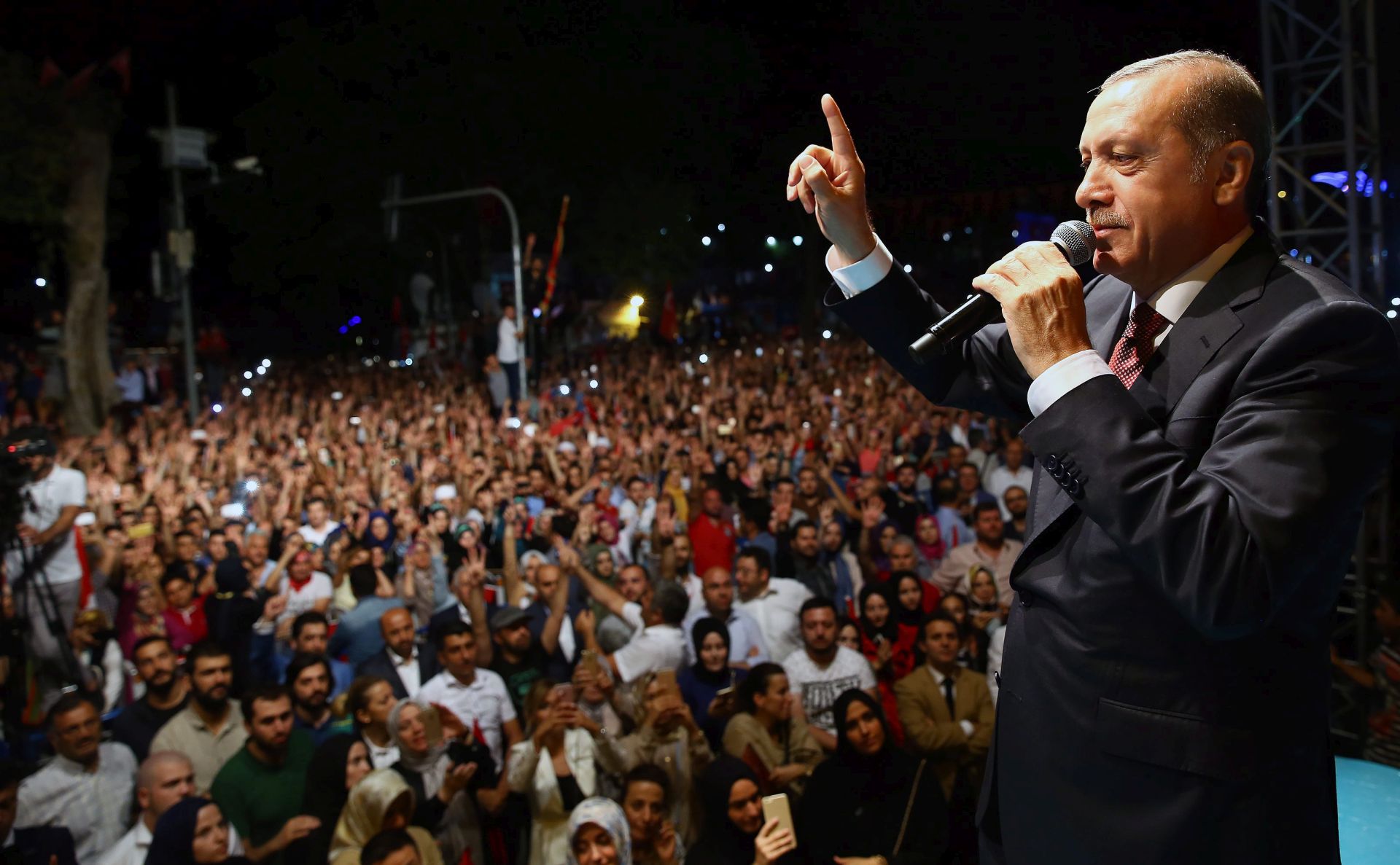 epa05431625 A handout picture provided by Turkish President Press office on 19 July 2016 shows, Turkish President Recep Tayyip Erdogan speaking during his rally in Istanbul, Turkey, midnight 18 July 2016. Turkish Prime Minister Yildirim reportedly said that the Turkish military was involved in an attempted coup d'etat. Turkish President Recep Tayyip Erdogan has denounced the coup attempt as an 'act of treason' and insisted his government remains in charge. Some 104 coup plotters were killed, 90 people - 41 of them police and 47 are civilians - 'fell martrys', after an attempt to bring down the Turkish government, the acting army chief General Umit Dundar said in a televised appearance.who were killed in a coup attempt on 16 July, during the funeral, in Istanbul, Turkey, 17 July 2016. Turkish Prime Minister Yildirim reportedly said that the Turkish military was involved in an attempted coup d'etat. Turkish President Recep Tayyip Erdogan has denounced the coup attempt as an 'act of treason' and insisted his government remains in charge. Some 104 coup plotters were killed, 90 people - 41 of them police and 47 are civilians - 'fell martrys', after an attempt to bring down the Turkish government, the acting army chief General Umit Dundar said in a televised appearance.  EPA/TURKISH PRESIDENTAL PRESS OFFICE / HANDOUT  HANDOUT EDITORIAL USE ONLY/NO SALES