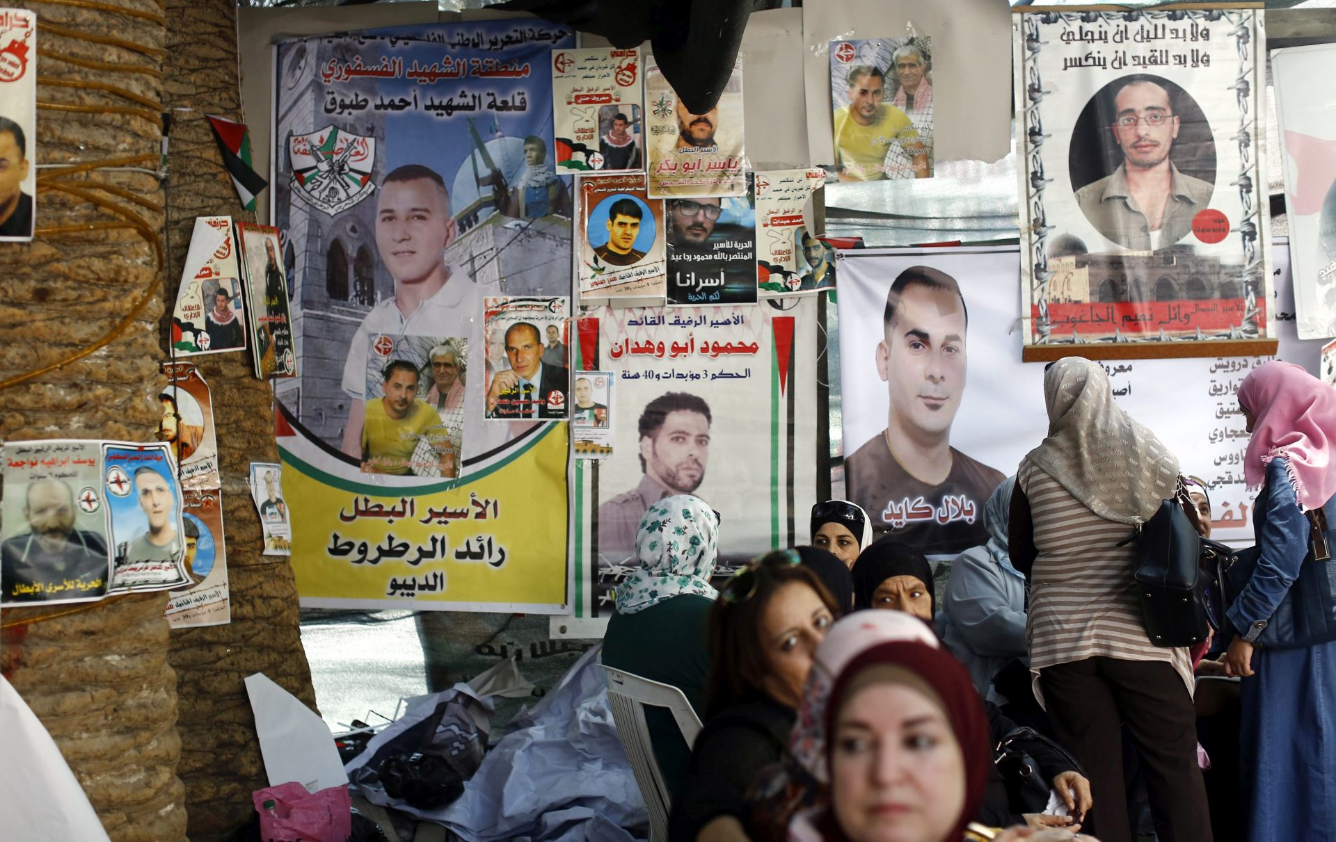 epa05453007 Palestinians sit inside a protest tent demanding the release of Palestinian prisoners who are on hunger strike in Israeli jails, in the West Bank city of Nablus, 03 August 2016. Palestinian prisoners in Israeli jails went on hunger strike in solidarity with Bilal Kayed, a member of Popular front for liberation of Palestine (PFLP) who started his hunger strike on 15 June 2016. after being more than 14 years imprisoned in Israeli jails. Kayed, one of 750 fellow Palestinians held in administrative detention without charge or trial, was put under administrative detention after having served a 14.5-years sentence in prison  EPA/ALAA BADARNEH