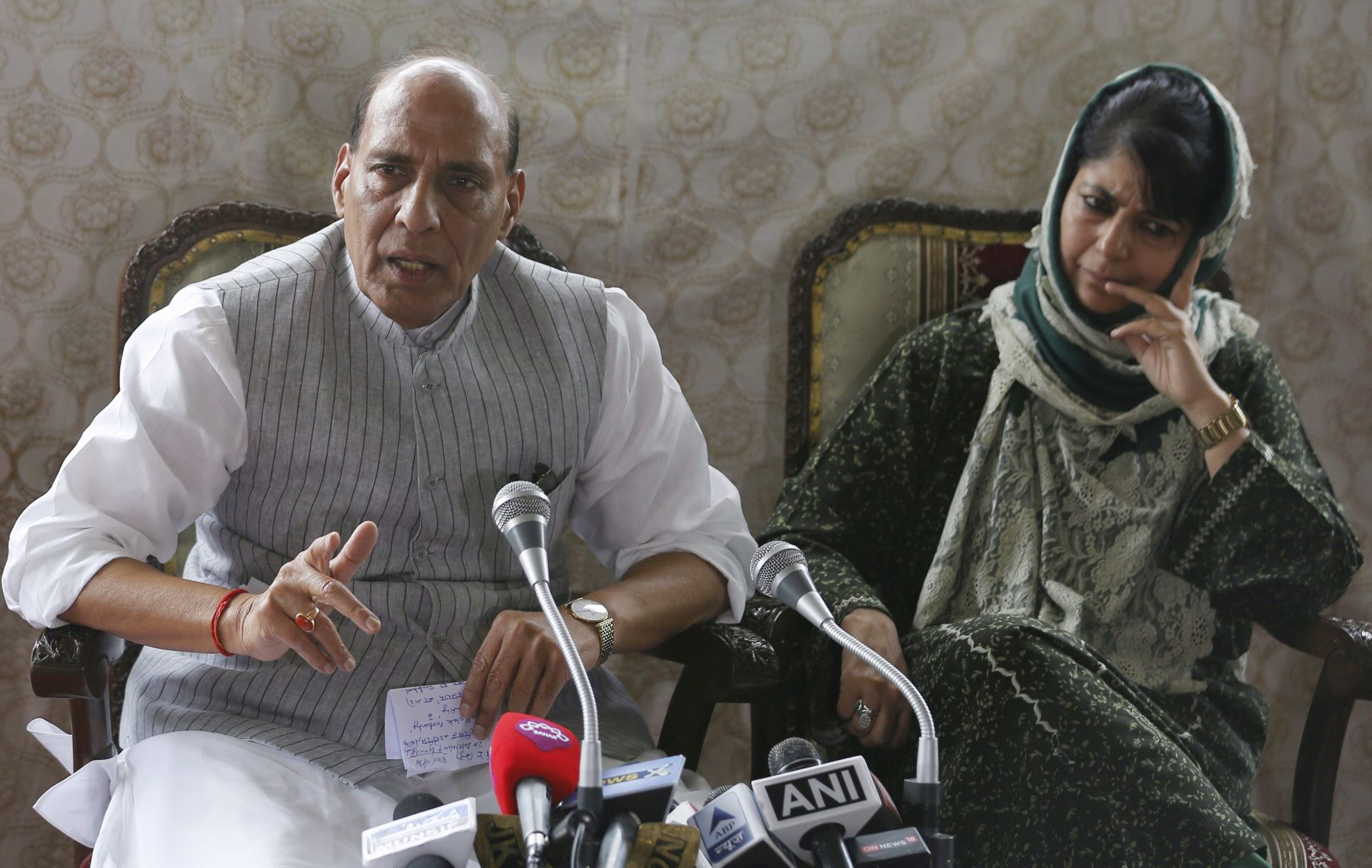 epa05509396 Indian Home Minister Rajnath Singh addressing a joint press conference with Indian Kashmir Chief Minister Mehbooba Mufti at her Fair View residence in Srinagar, the summer capital of Indian Kashmir, India, 25 August 2016. Singh, who visited Indian Kashmir for the second time in a month, appealed to people of Kashmir to help restore peace in the valley saying that an expert committee of Government of India would within few days give an alternative to the pellet gun for crowd control measures in the restive region. Over 65 people have been killed and more than 7,000 were injured, some of them blinded by pellets, during the past one-and-a-half month summer unrest across Indian Kashmir following the killing of Hizb-ul-Mujahideen commander, Burhan Muzaffar Wani and his two associates in a gunfight on 08 July 2016.  EPA/FAROOQ KHAN