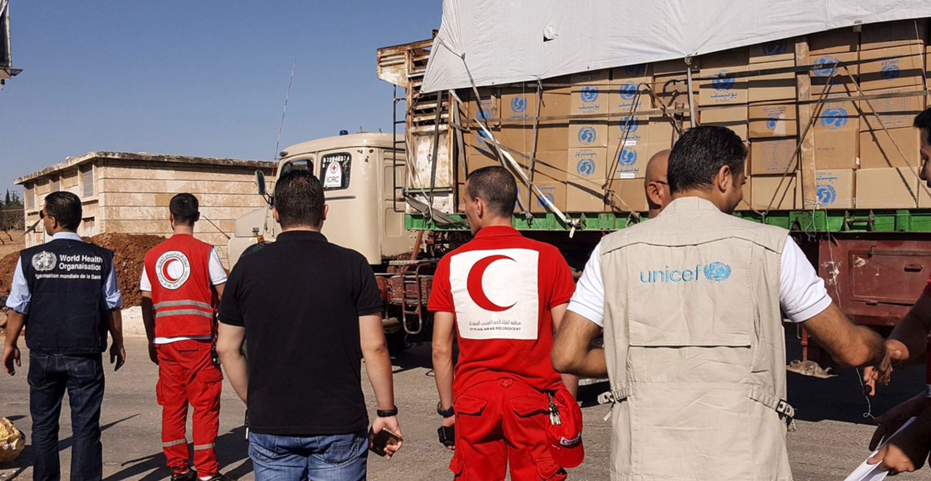 epa05548474 A handout picture made available on the website of Syrian Red Crescent  showing an aid convoy of 31 trucks preparing to set off to deliver aid to the western rural side of Aleppo, Syria, 19 September 2016. Reports state that Syrian Red Crescent trucks were bombed after a routine delivery of supplies to the beleaguered city of Aleppo in which more than 10 people were killed in the attack, a Red Cross Official has said.  EPA/SYRIAN RED CRESENT / HANDOUT  HANDOUT EDITORIAL USE ONLY/NO SALES