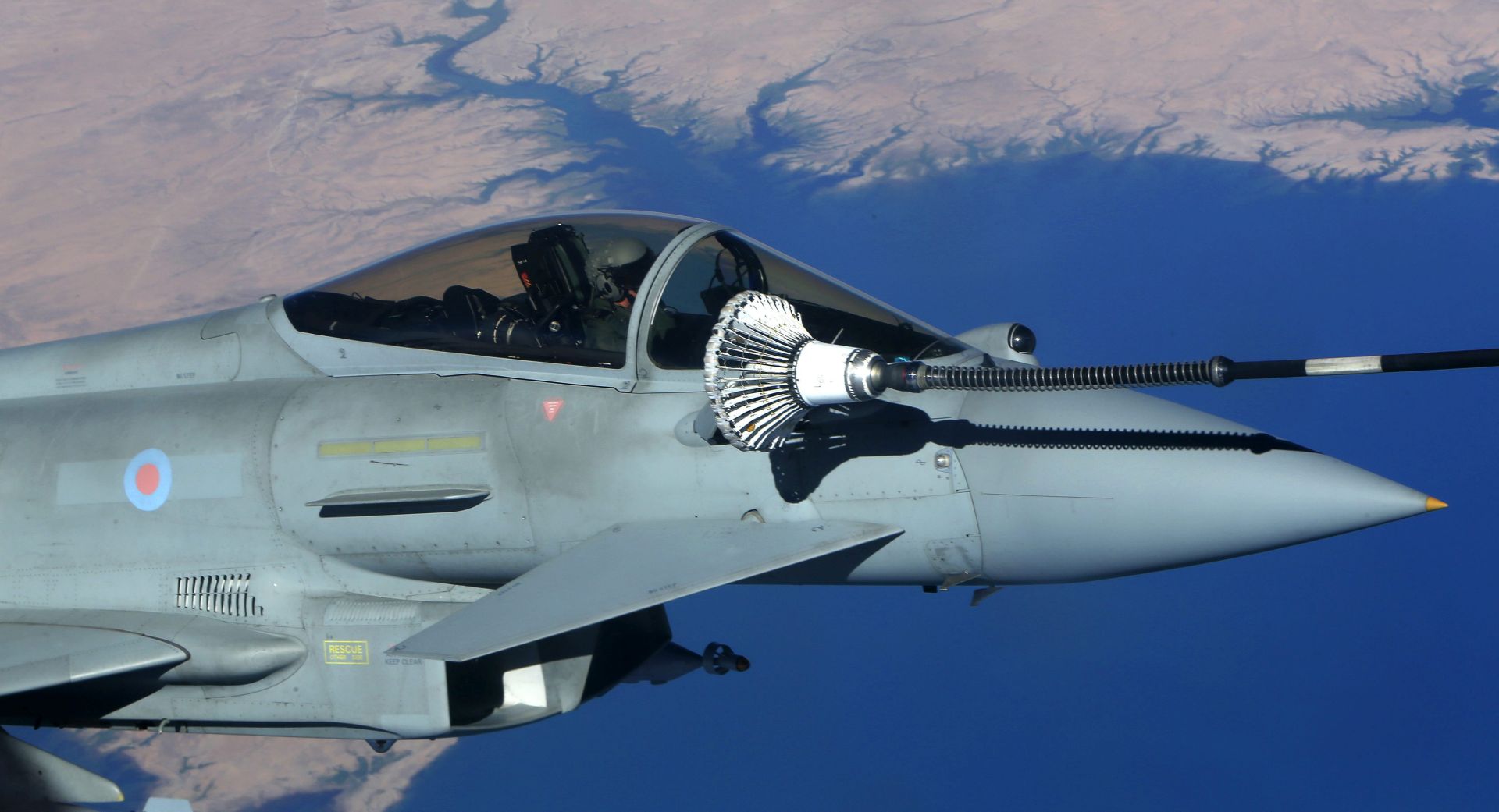 epa05554954 Photo made available 23 September 2016 of a typhoon aircraft refueling from a tanker aircraft during Operation Shader, at an undisclosed location in Iraq, 21 September 2016. British Tornado and Typhoon aircraft are attacking Islamic State targets ahead of a major offensive by Iraqi security forces to recapture the key Iraqi city of Mosul.  EPA/PETROS KARADJIAS/ POOL 
Photos have been submitted to British military officials in the UK in accordance with security requirements