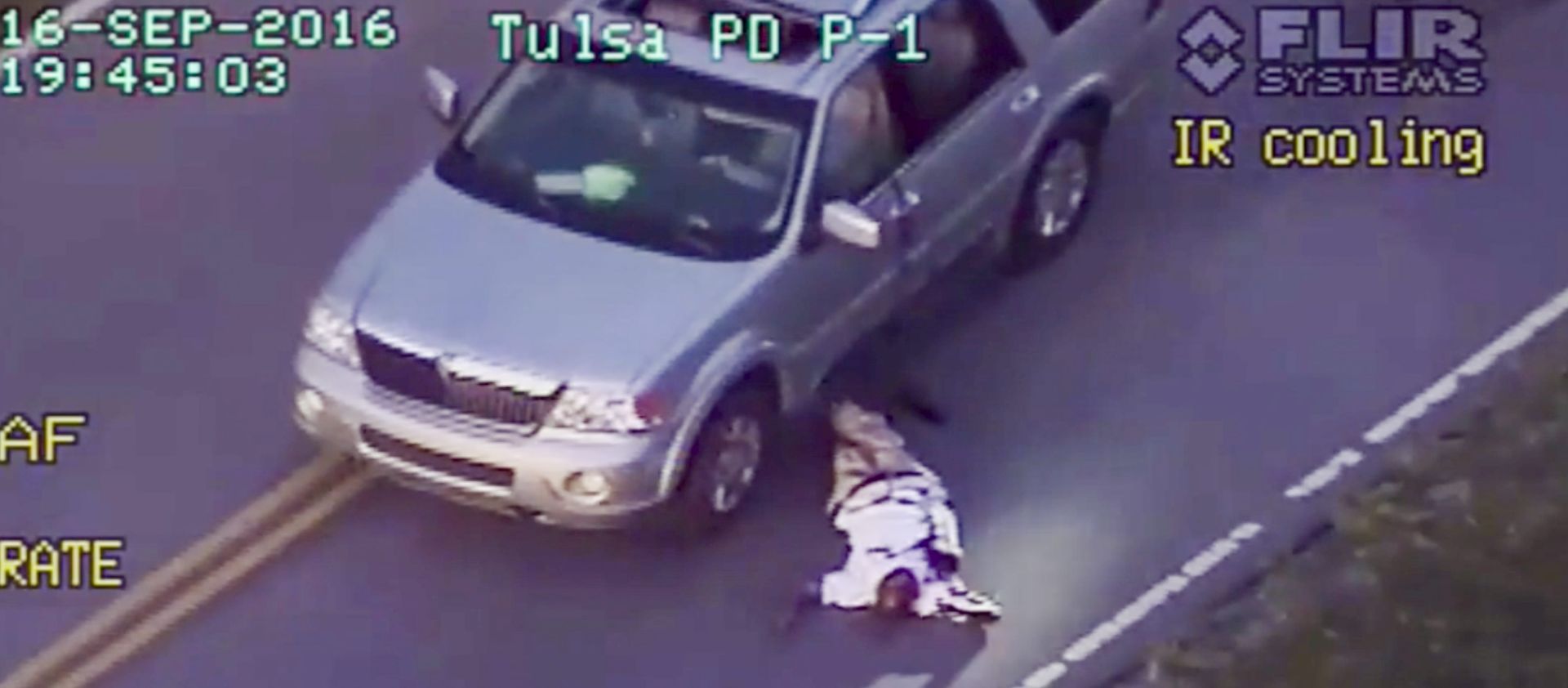 epa05549236 A frame grab from video released by the Tulsa, Oklahoma, USA, Police Department and acquired on 20 September 2016 reportedly shows Terrence Crutcher (R) lying on the ground as he is tasered and shot by police after his automobile broke down in Tulsa, Oklahoma, USA, on 16 September 2016. Crutcher died after being taken to a hospital later that night. No weapon was found either on Crutcher or in his vehicle.  EPA/TULSA POLICE DEPARTMENT / HANDOUT  HANDOUT EDITORIAL USE ONLY/NO SALES