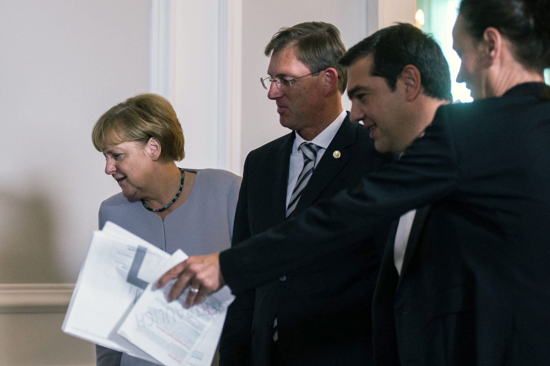 epa05554215 (L-R) German Chancellor Angela Merkel, Slovenian Prime Minister Miro Cerar and Greek Prime Minister Alexis Tsipras arrive for a group photo call during the Summit 'Migration along the Balkan route' in Vienna, Austria, 24 September 2016. Austrian Chancellor Christian Kern invited Heads of Government of Albania, Bulgaria, Germany, Greece, Croatia, FYROM (Former Yugoslav Republic of Macedonia), Serbia, Slovenia, Hungary, the President of the European Council, the European Commissioner for Migration and Interior Minister of Romania to discus a common strategy for the migrants situation along the Balkan route.  EPA/CHRISTIAN BRUNA