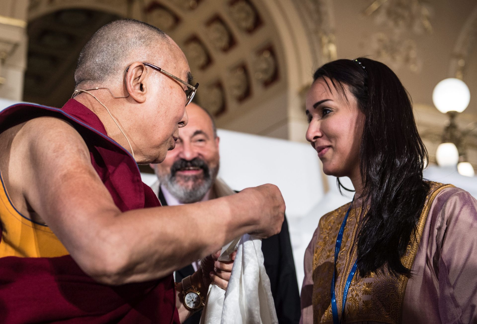 epa05590440 The Tibetans' spiritual leader, the Dalai Lama, Tenzin Gyatso (L), talks with Arabian women's rights activist Manal Al Sharif (R) during the international conference 'Forum 2000' in Prague, Czech Republic, 18 September 2016. Others are not identified. The annual conference convenes global leaders from politics, academia, religion, business and civil society to discuss key issues facing civilization. The theme of this year's conference is 'Courage to Take Responsibility'.  EPA/FILIP SINGER