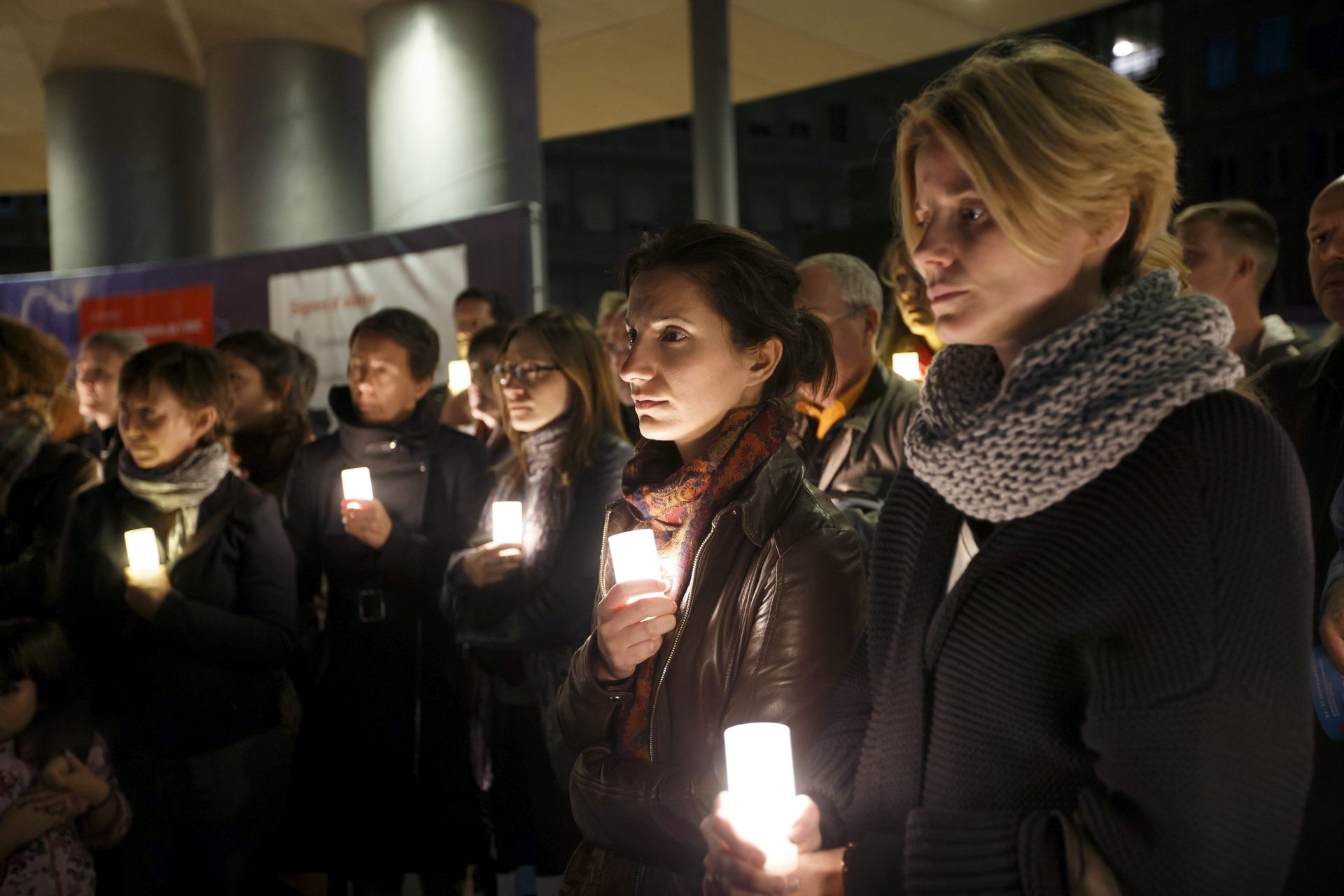 epa05568773 Participants and staff MSF (Medecins Sans Frontieres) hold lights during a commemoration for the victims of the US attack on the Kunduz hospital in Afghanistan, at the Geneva University Hospital (HUG) in Geneva, Switzerland, 03 October 2016. The Medecins Sans Frontieres, MSF, also known as Doctors Without Borders, launches the #NotATarget campaign so to increase the political costs of non-compliance of the laws of war and inform civil society of the non-compliance of unarmed populations in conflict zones.  EPA/SALVATORE DI NOLFI