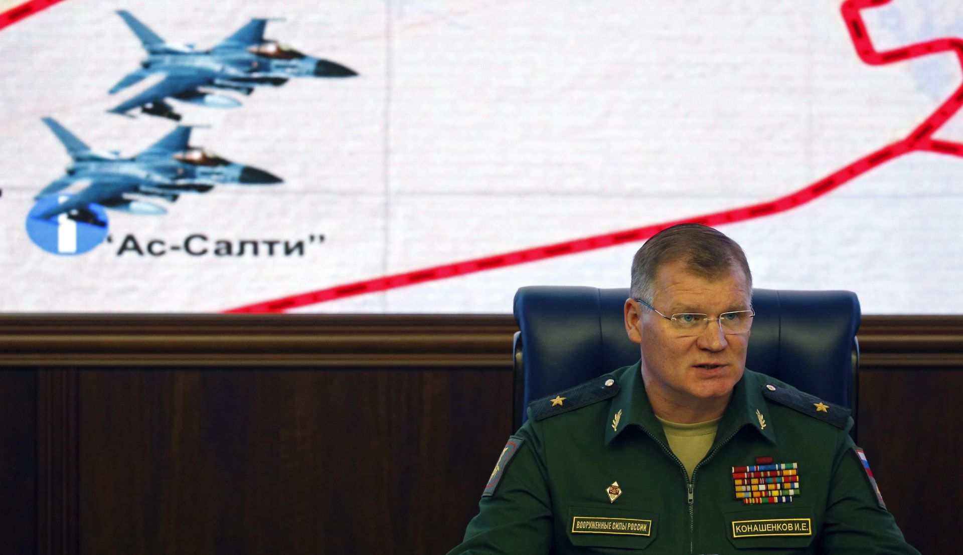 epa05594022 Russian Defence Ministry official representative general Igor Konashenkov makes an official statement for the media in Russian Defence Ministry in Moscow, Russia, 20 October 2016. Igor Konashenkov reported provided to the media detailed information, taken from Russian radars concerning the flight and airstrike of a pair of Belgian F-16 fighters. According to this information two Belgian combat jets F-16 took off 18 October from Jordanian airbase and after two-hours patrol flight receiving additional fuel from US flying tanker dropped bombs of Kurdish village Khassajek near Aleppo. Six residents of the village were killed during the airstrike.  EPA/SERGEI CHIRIKOV