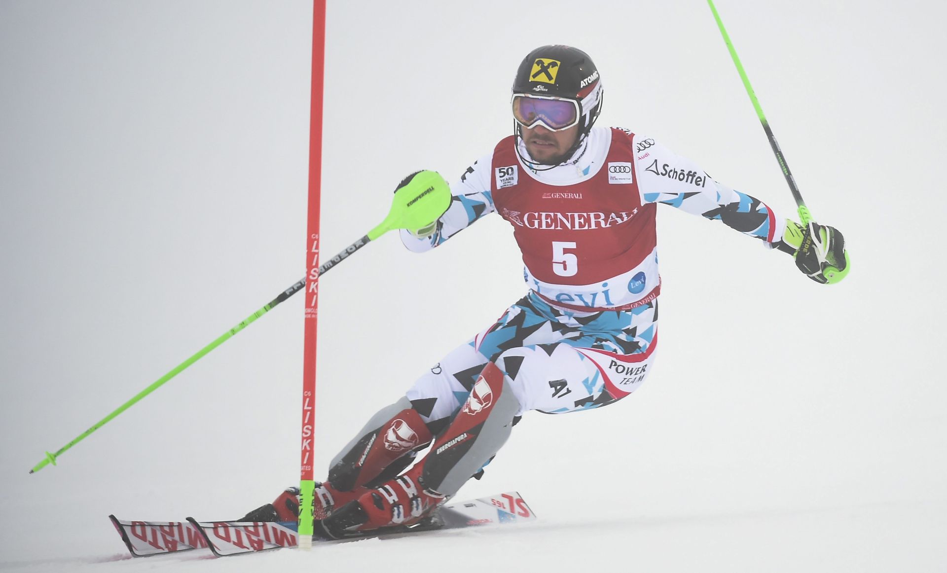 epa05629359 Marcel Hirscher of Austria clears a gate during the Men's Slalom race at the FIS Alpine Skiing World Cup event in Levi, Finland, 13 November 2016.  EPA/MARKKU OJALA FINLAND OUT