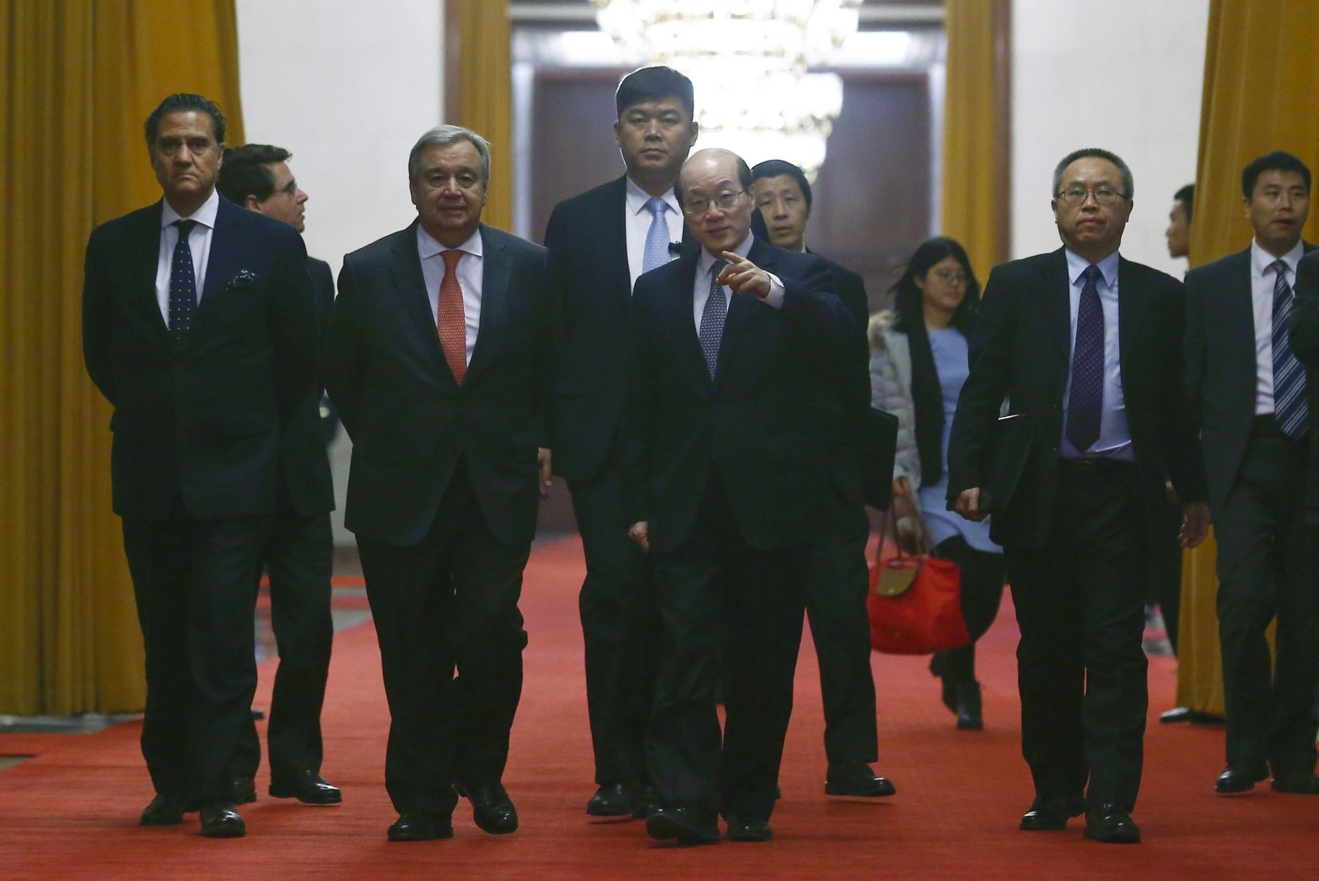 epa05650536 U.N. Secretary-General-designate Antonio Guterres (2-L) arrives at the Great Hall of the People for a meeting with Chinese officials in Beijing, China, 28 November 2016.  EPA/THOMAS PETER/POOL