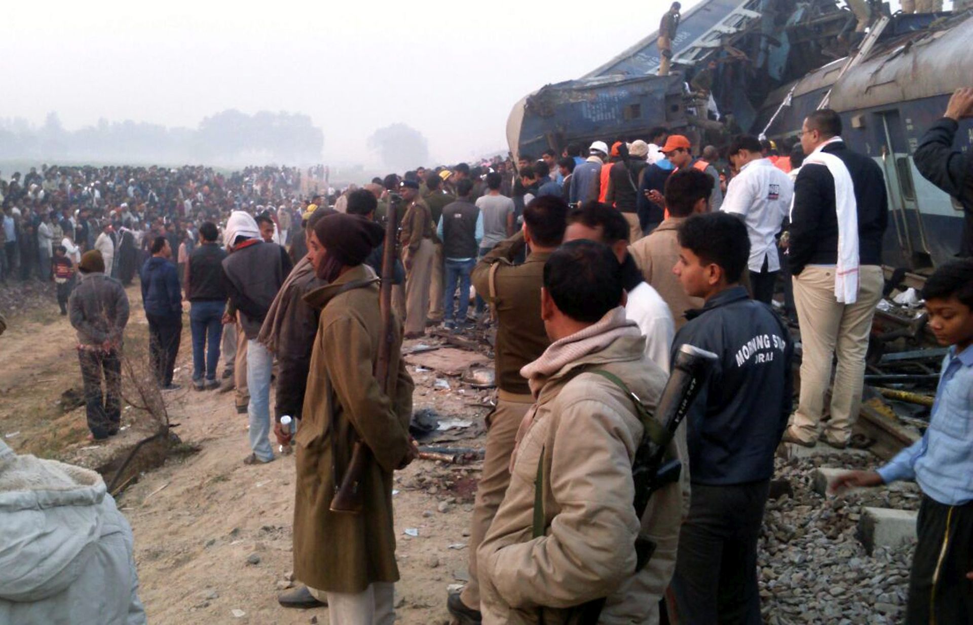 epa05639140 People gather at the spot as rescue works continue at the site of an accident where coaches of an Indore-Patna Express train derailed off the tracks, near Pukhrayan area, in Kanpur, India, 20 November 2016. According to reports, over 60 people were killed and more than 100 were injured after 14 coaches of an Indore-Patna Express train derailed in the early morning hours.  EPA/RITESH SHUKLA -- BEST QUALITY AVAILABLE