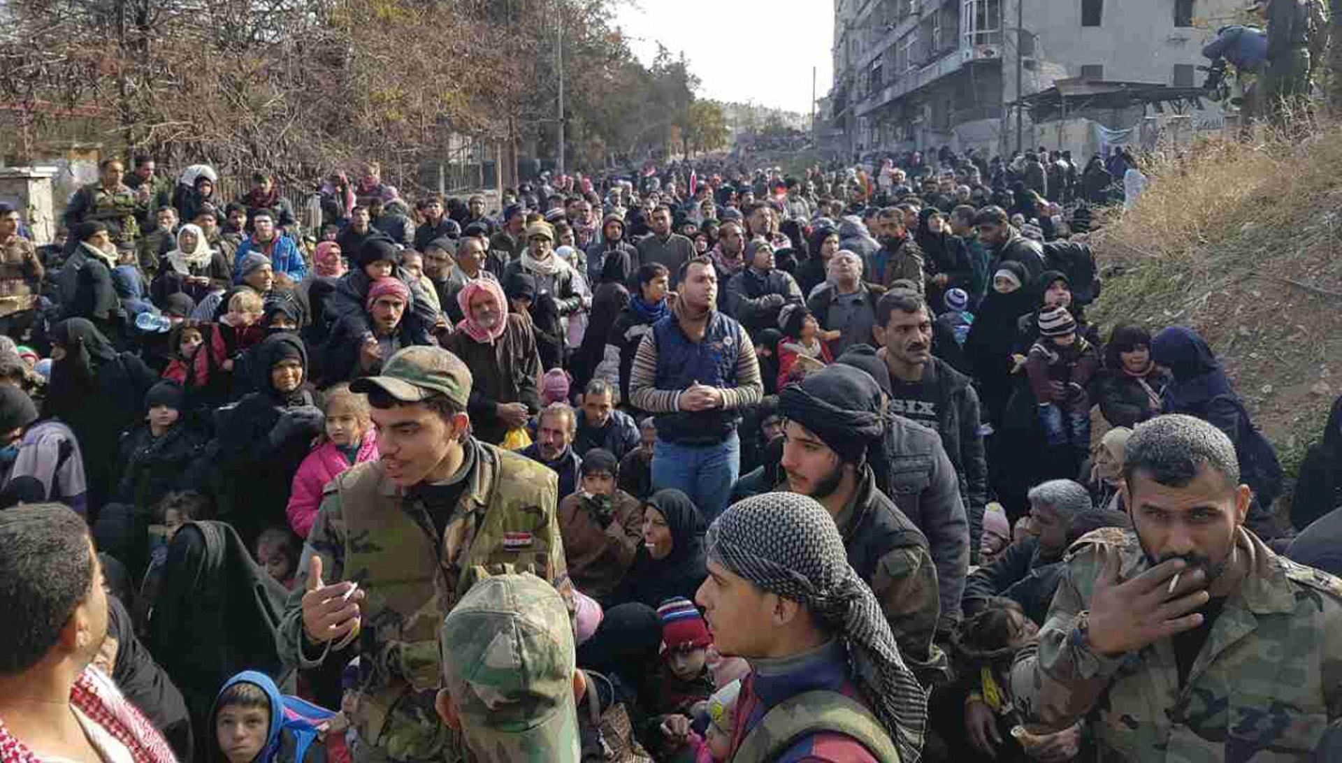 epa05666080 People gather to leave Al-Salhen neighborhood in the eastern part of the northern city of Aleppo, Syria, 08 December 2016. More people are fleeing Aleppo eastern districts as the Syrian government forces move to recapture more districts, where they are involved in a large-scale offensive to expel the insurgents. Syrian rebel factions have also fully retreated from the historic center of Aleppo.  EPA/STRINGER BEST QUALITY AVAILABLE