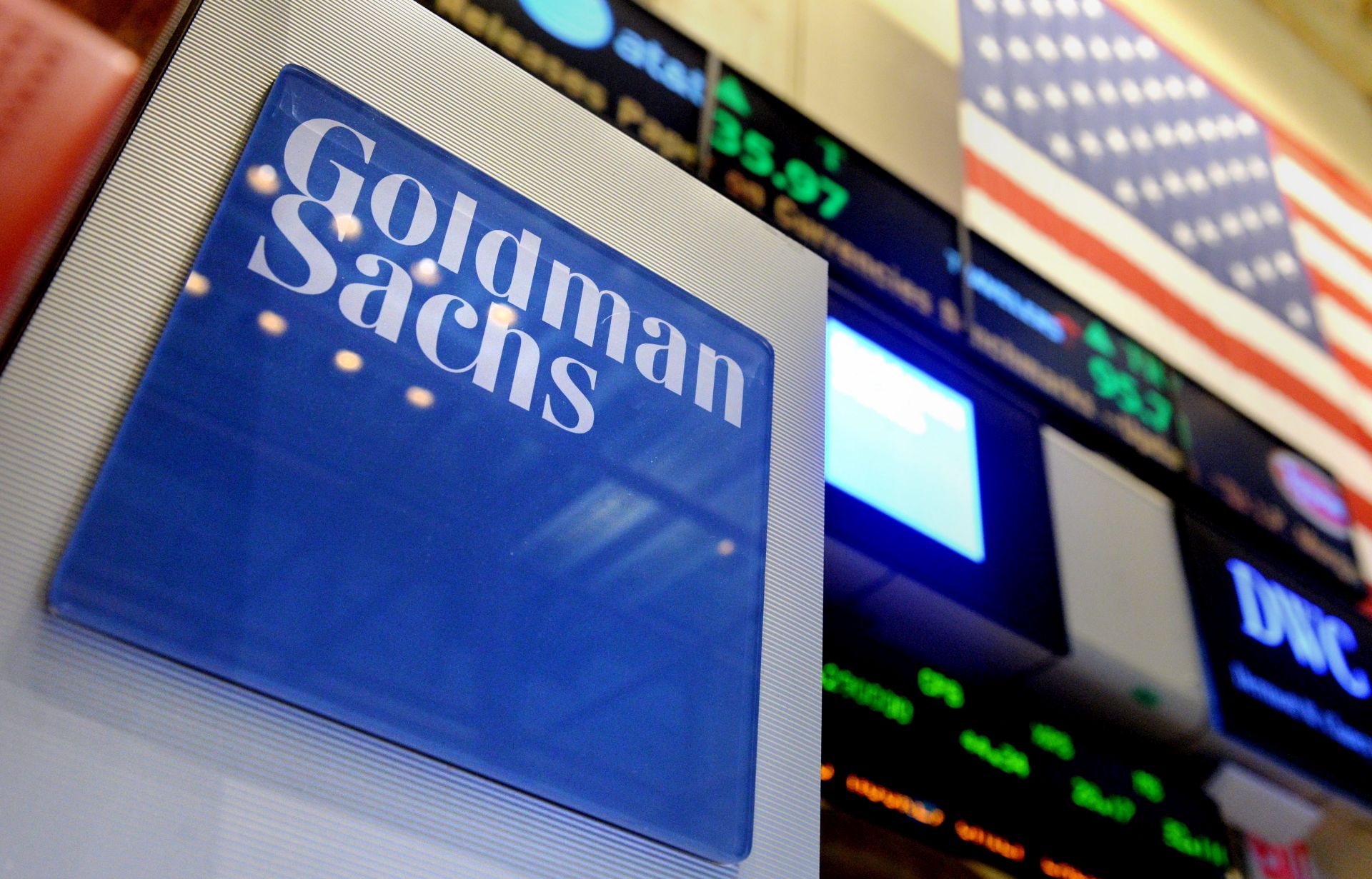 epa05101278 (FILE) A file photo dated 15 July 2014 showing a sign of US bank Goldman Sachs on the floor of the New York Stock Exchange at the start of the trading day in New York, New York, USA. Media reports in USA state Goldman Sachs may be planning to reduce their staff in trading and sales by some 5-10 per cent during the first quarter in 2016.  EPA/JUSTIN LANE